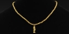 Gold Bead and Figural Pendant Necklace Gold Bead and Figural Pendant Necklace