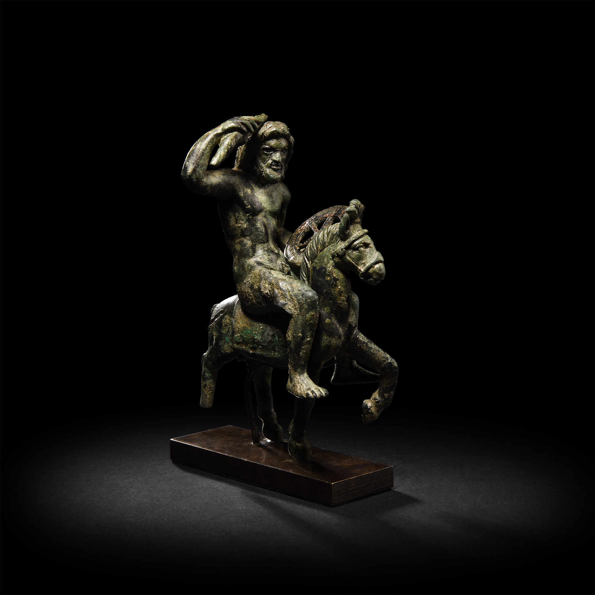 A Gallo-Roman bronze statuette of the god Taranis on horseback, a thunderbolt raised in his hand