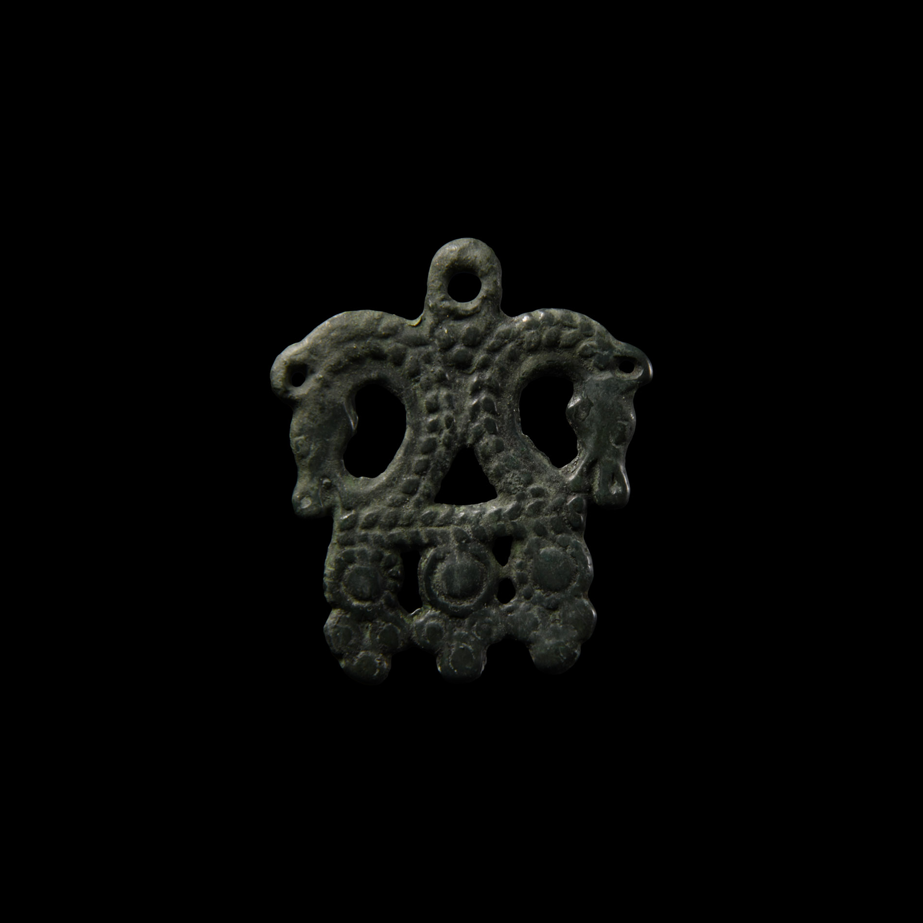 Viking Age Bronze Pendant with Opposed Horse Heads