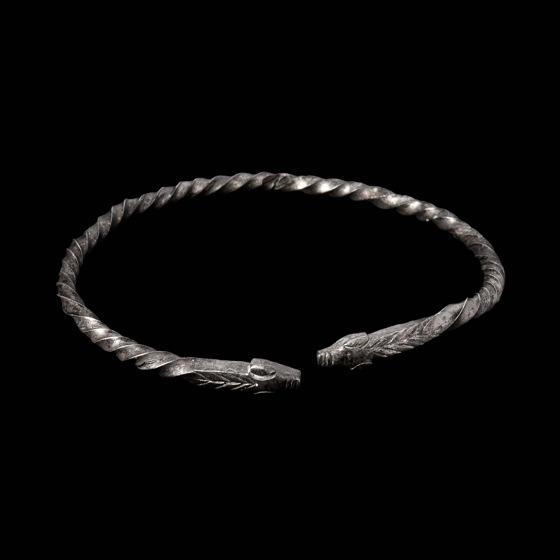 Viking Age Silver Twisted Bracelet with Animal Head Terminals