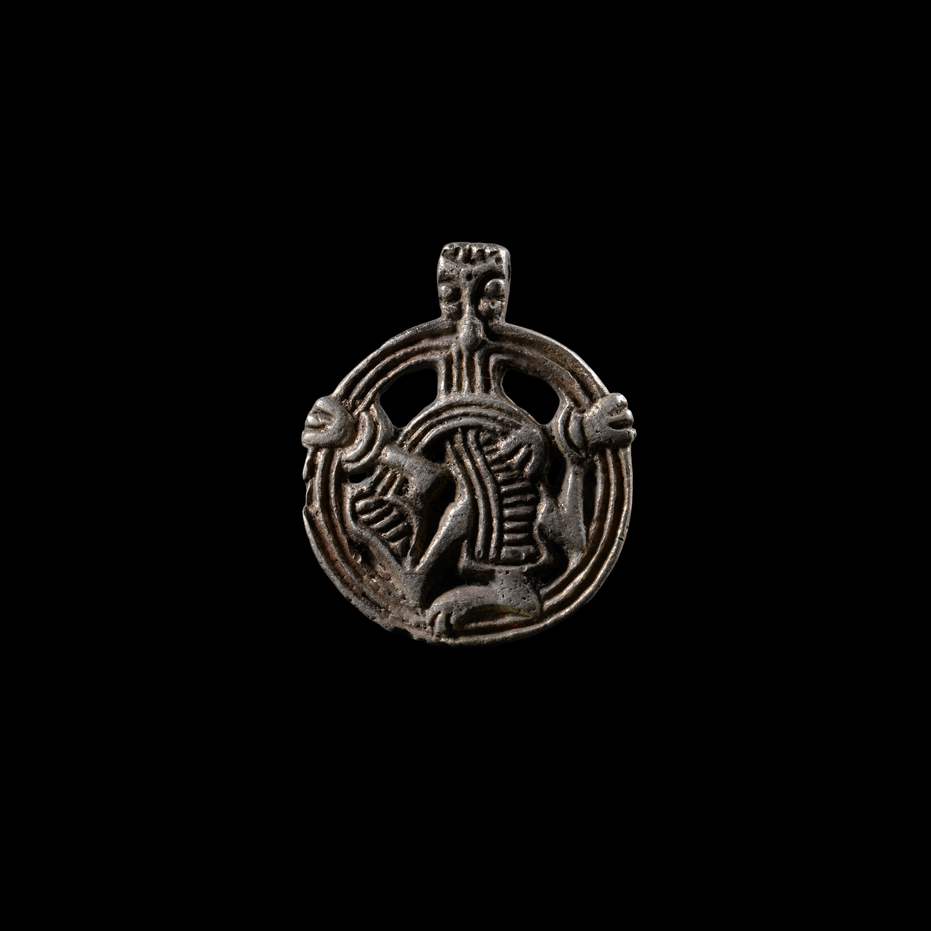Viking Age Silver Pendant with Gripping Beast
