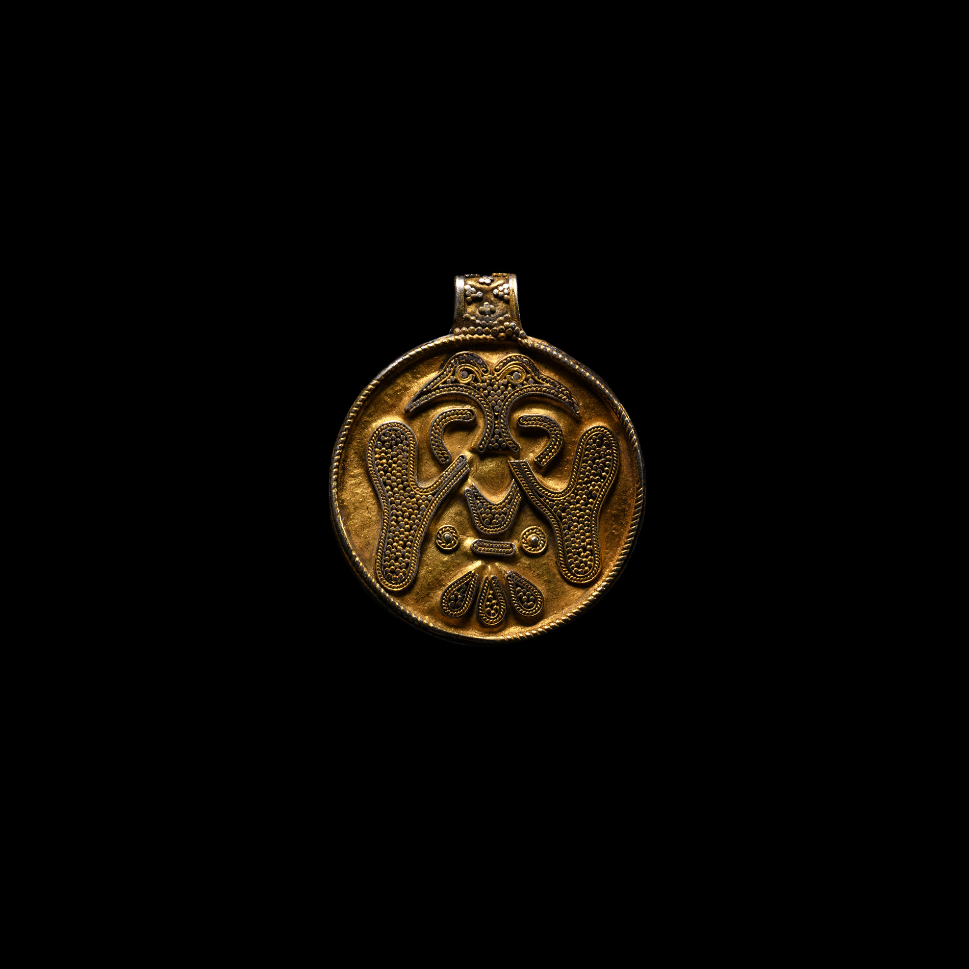 Viking Age Silver-Gilt Filigree Pendant with Conjoined Ravens
