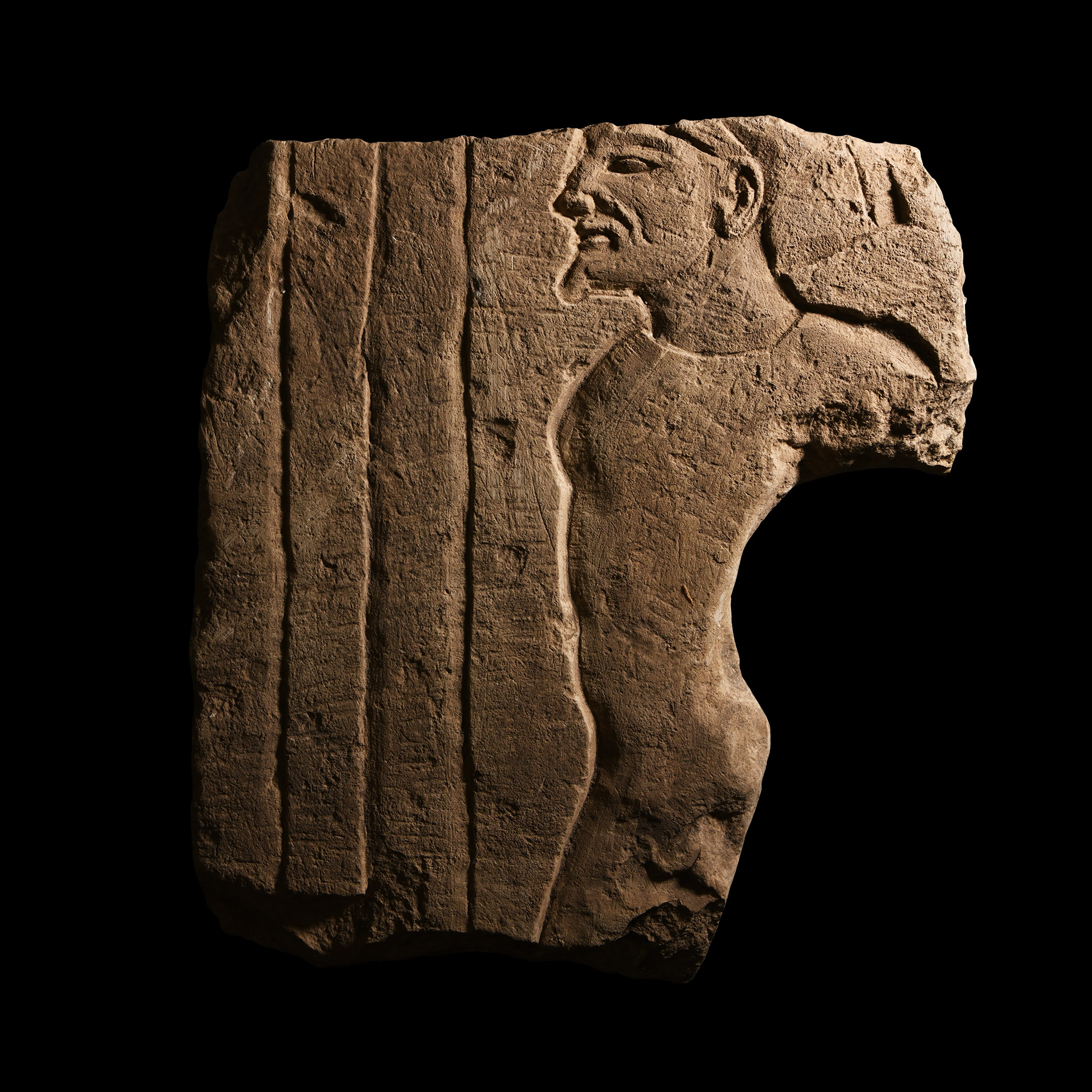 Egyptian Limestone Relief with Bound Asiatic Captive