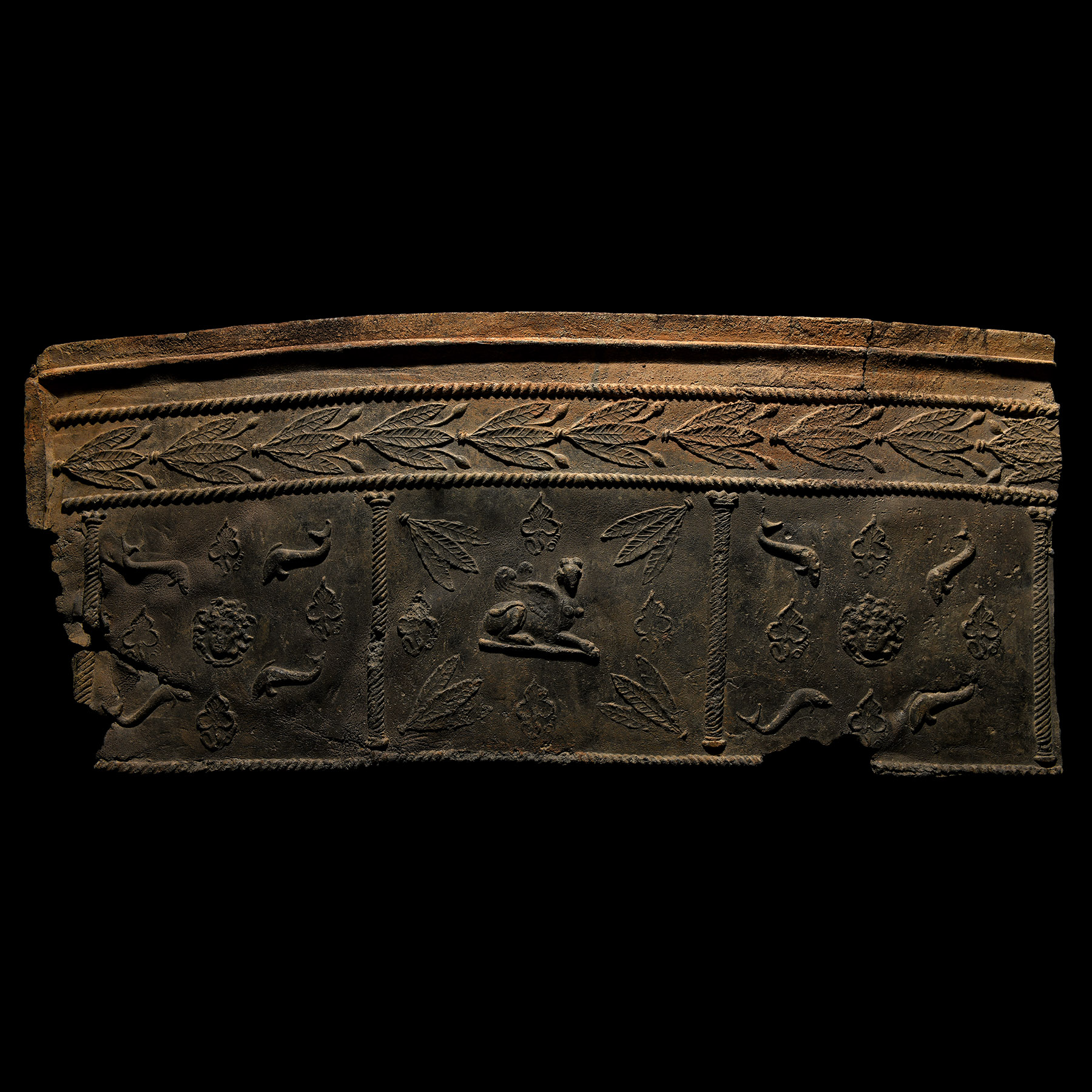 Roman Lead Coffin Panel with Sphinx, Medusa and Dolphins