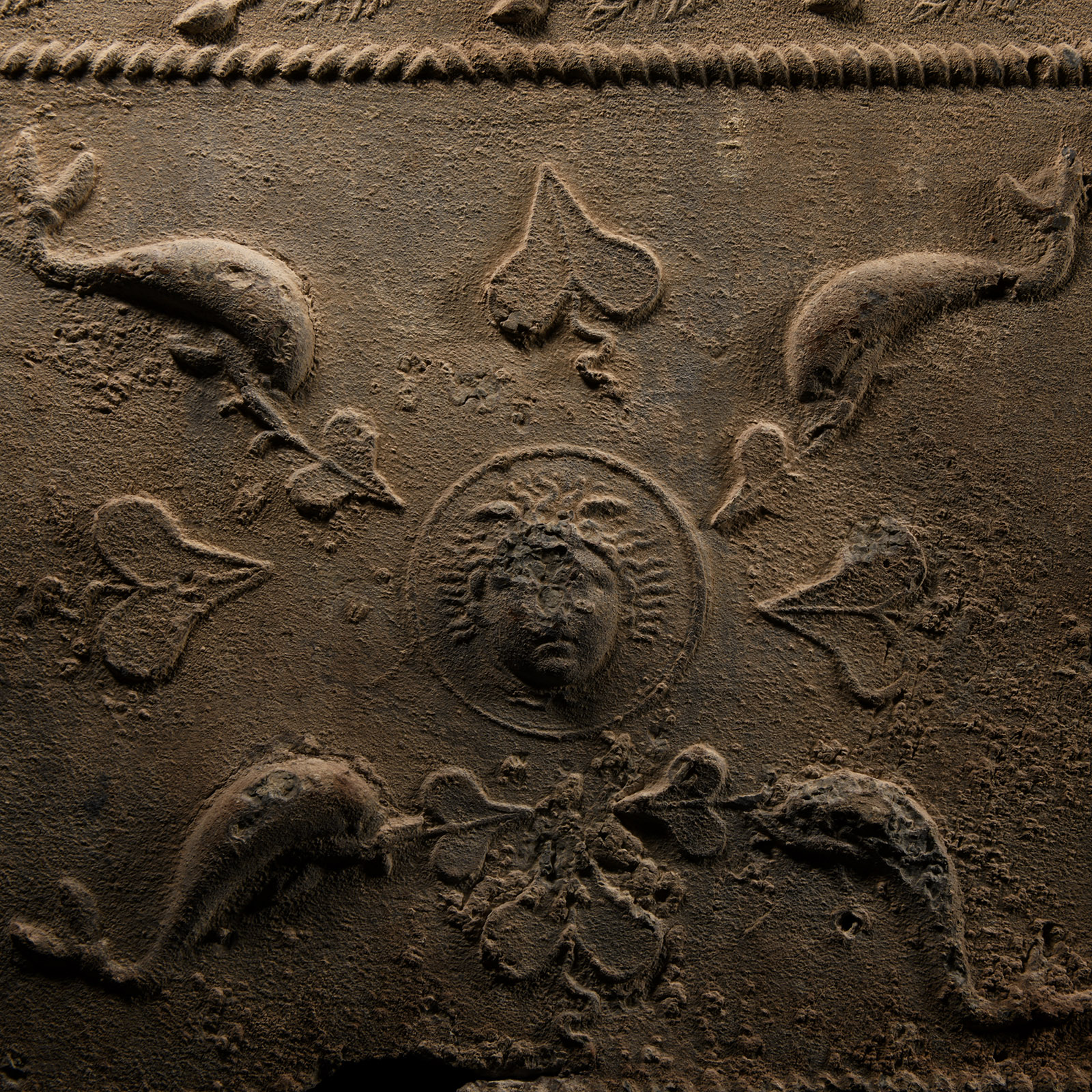 Roman Lead Coffin Fragment with Sphinx, Medusa and Dolphins