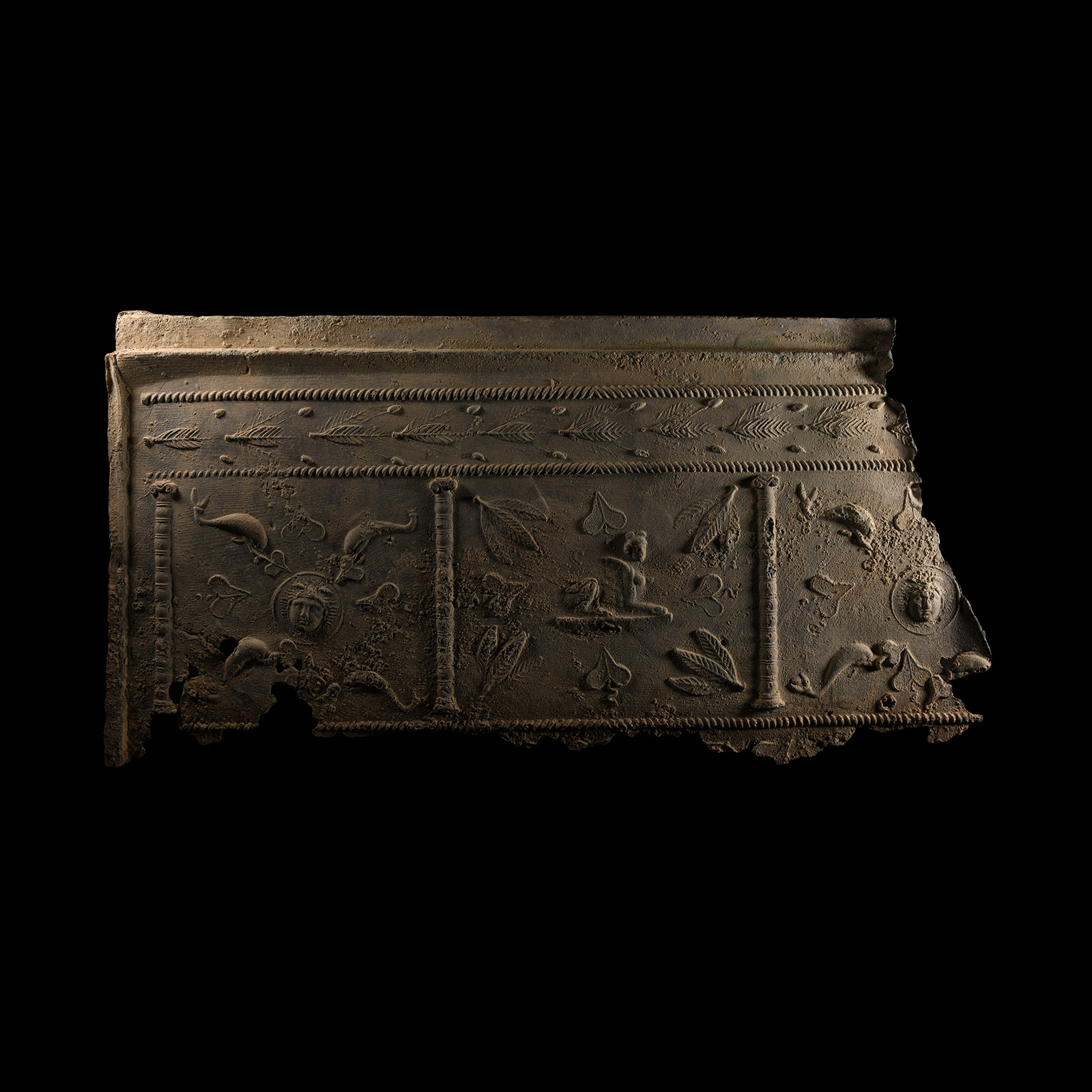 Roman Lead Coffin Panel with Sphinx, Medusa and Dolphins