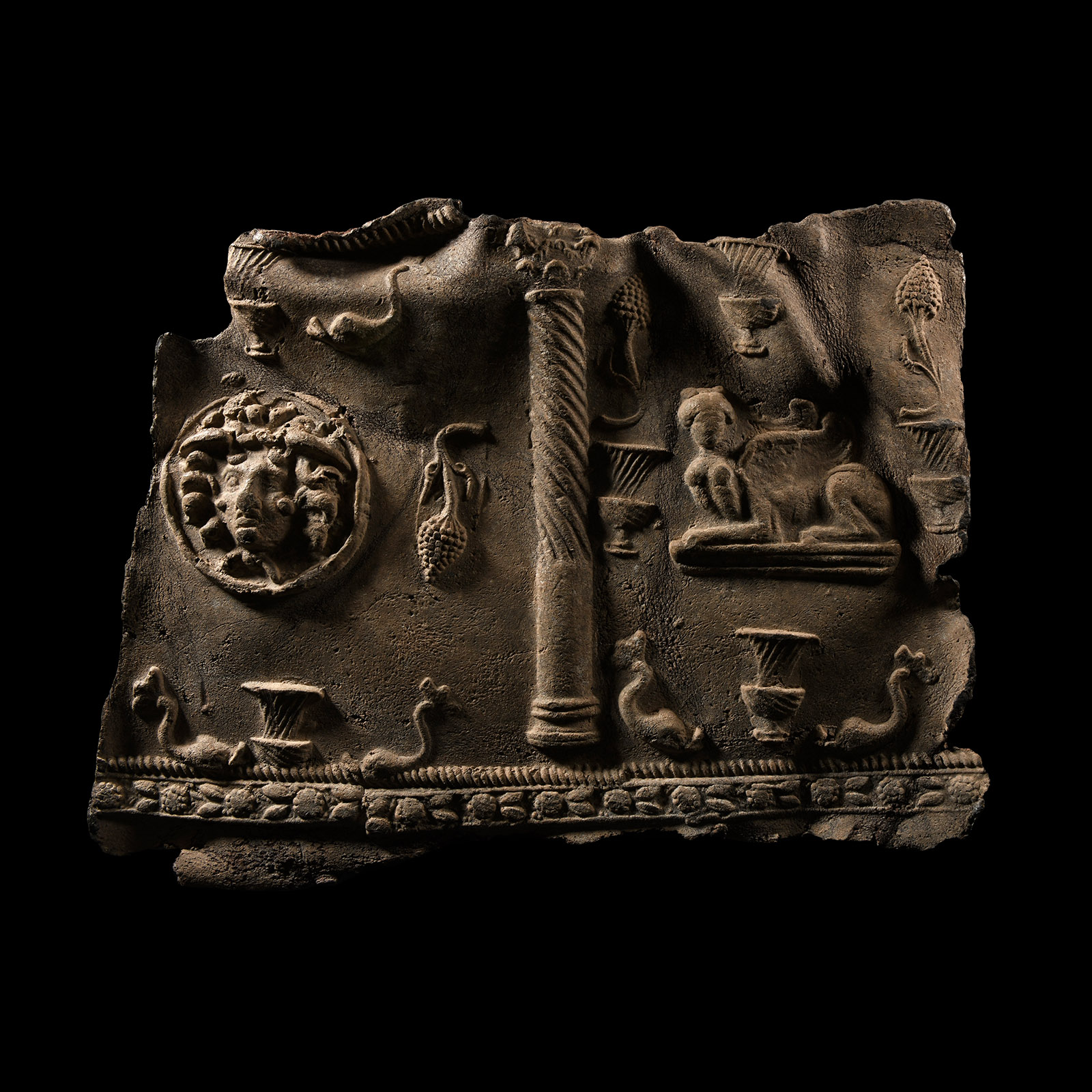 Roman Lead Sarcophagus Panel with Sphinxes, Dolphins and Masks of Medusa