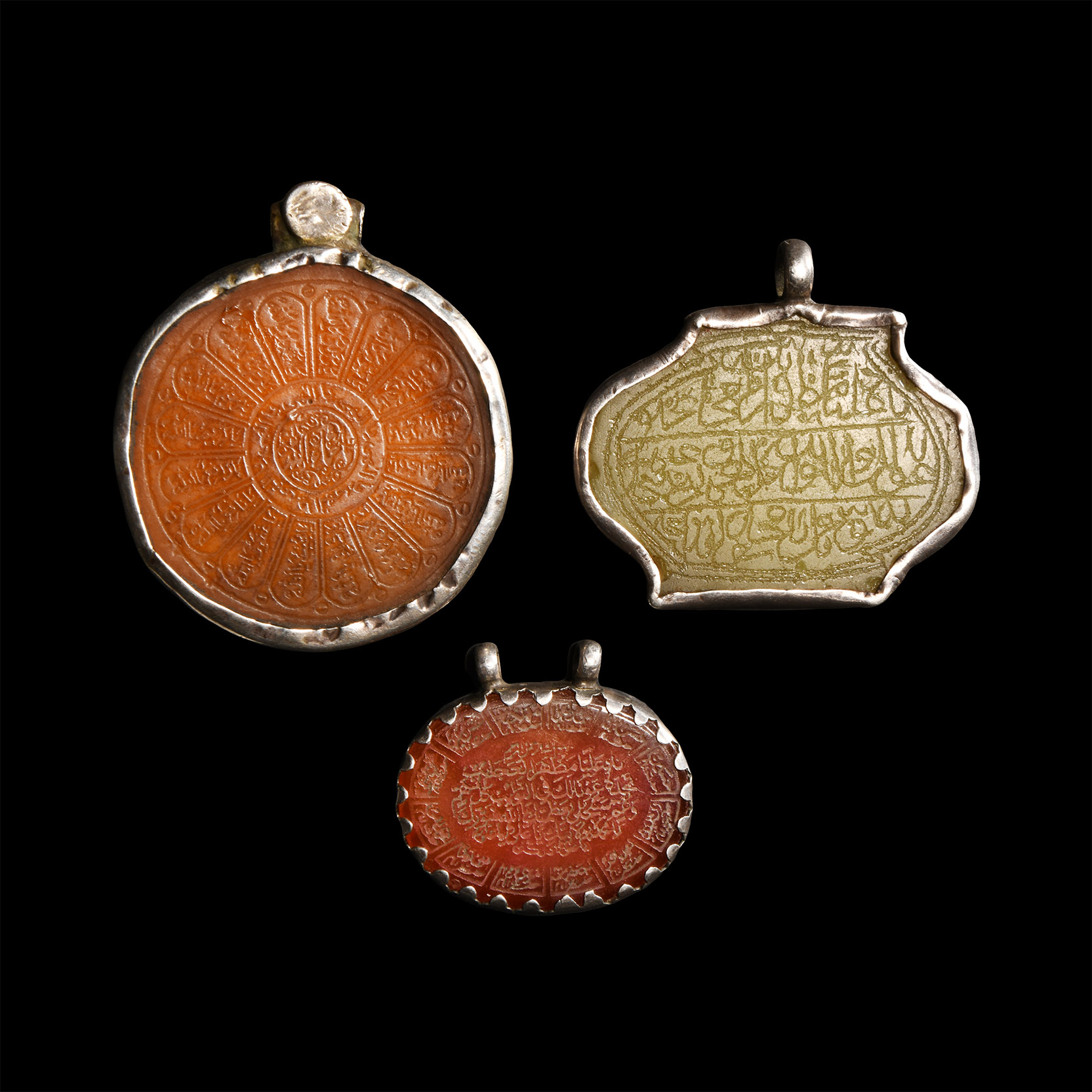 Stone Pendant Group with Calligraphic Inlays