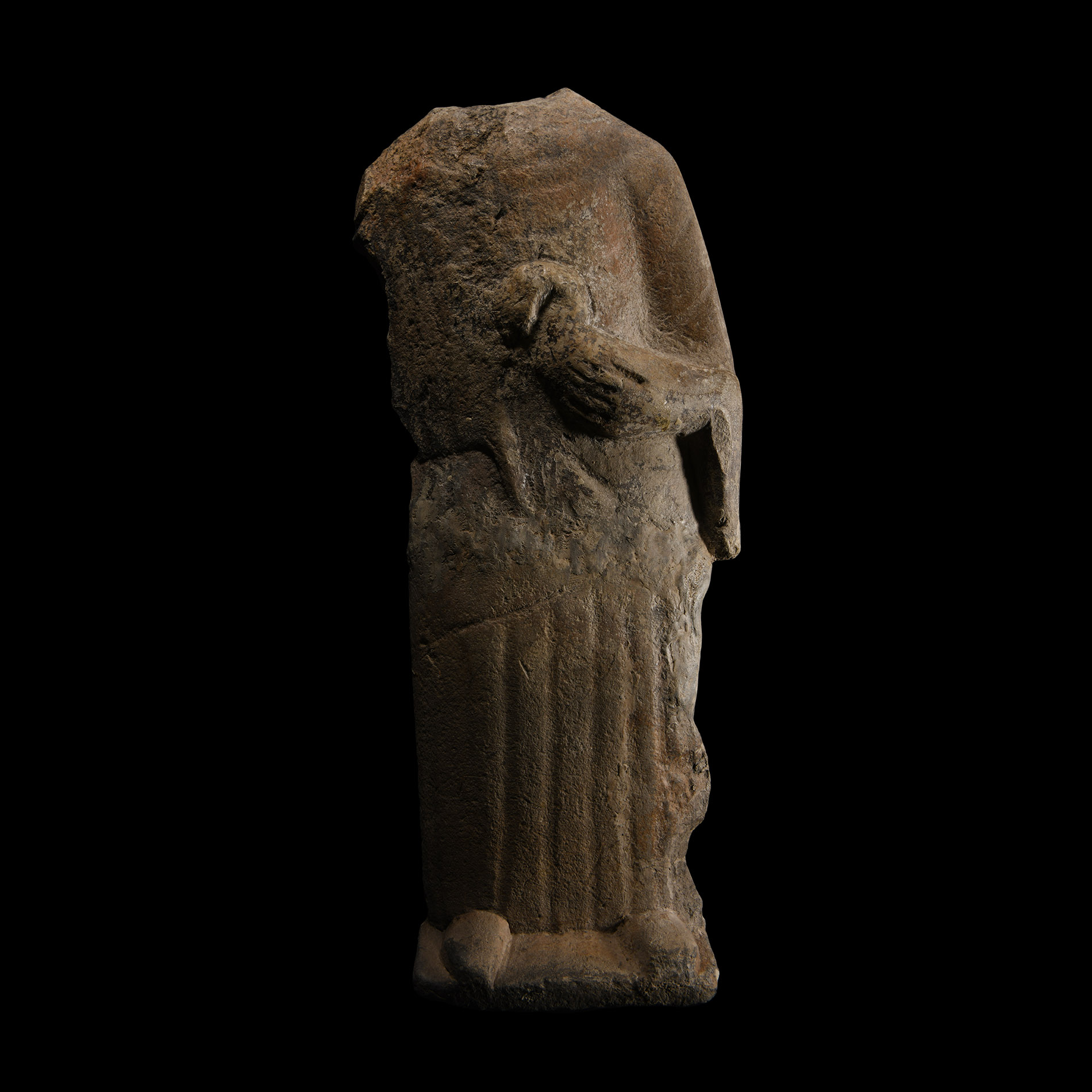 Phoenician Limestone Standing Goddess Holding a Bird