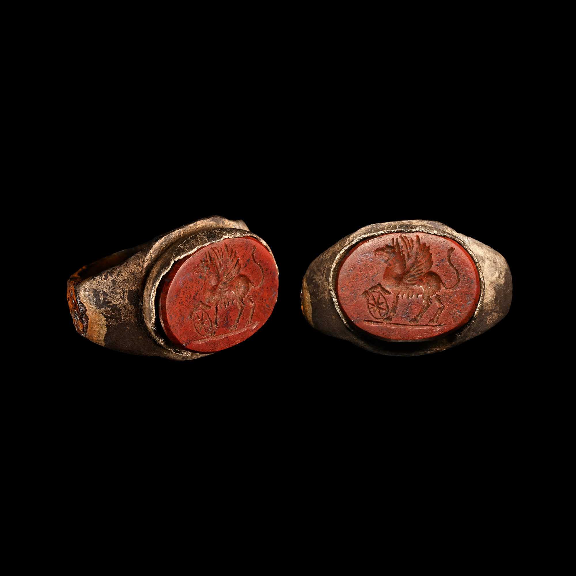 Roman Bronze Ring with Gryphon and Shield Gemstone