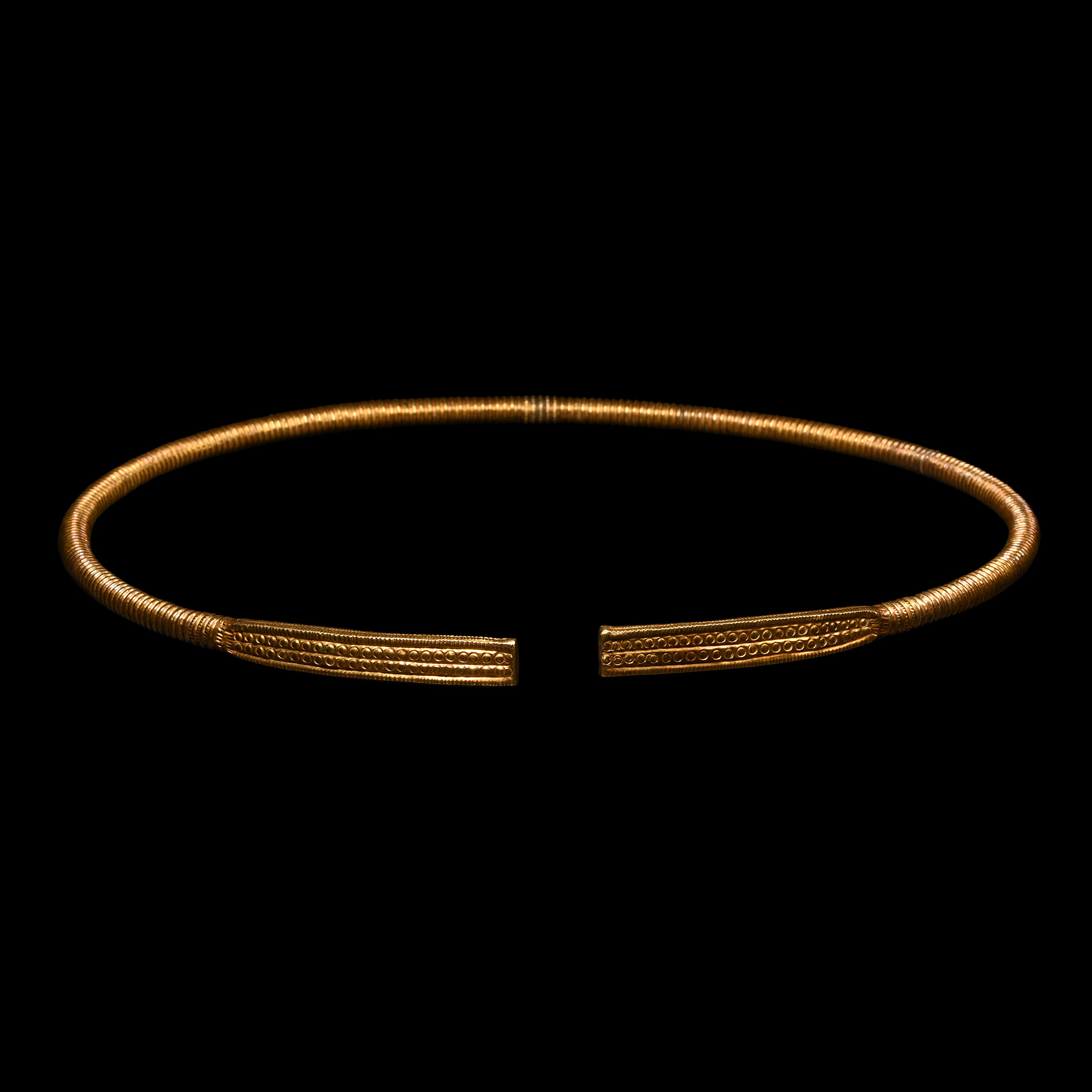 Scythian Gold Clad Ribbed Torc with Decorated Terminals