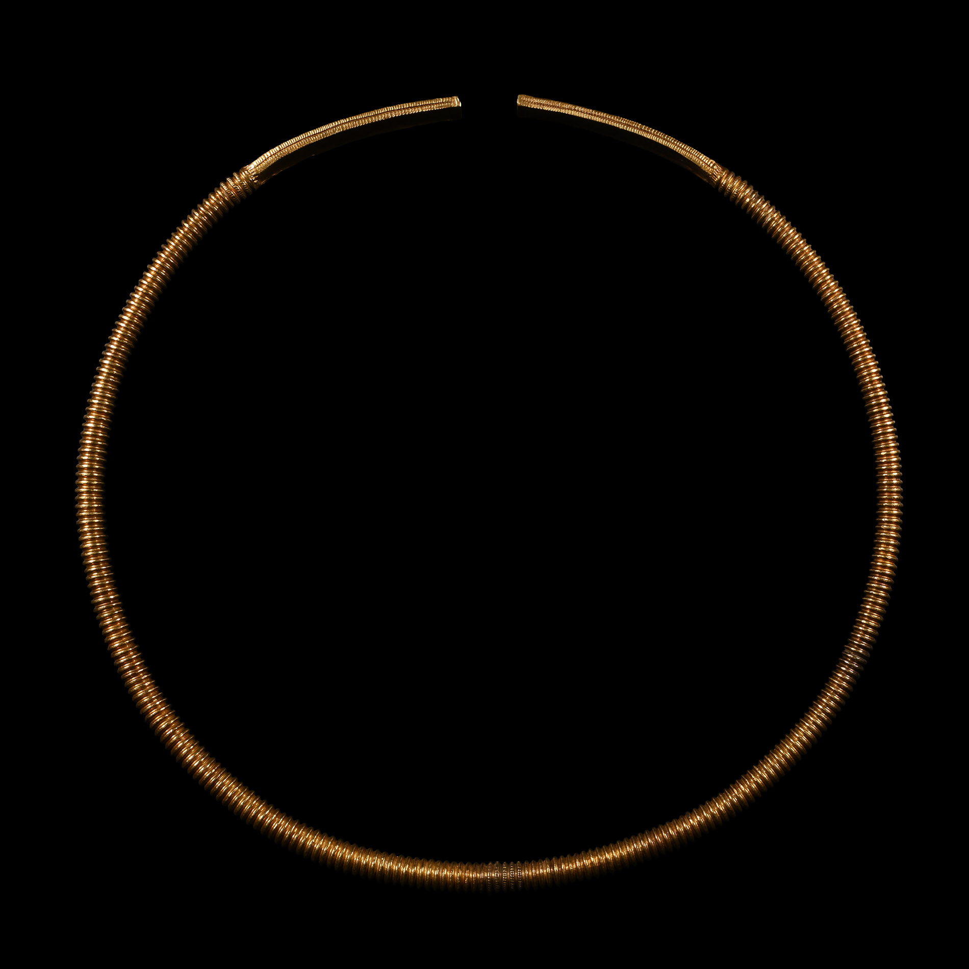 Scythian Gold Clad Ribbed Torc with Decorated Terminals