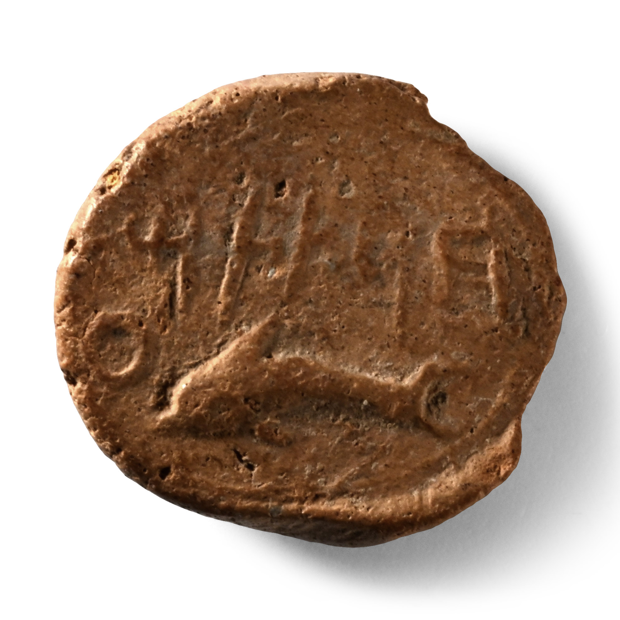 Phoenician Terracotta Bulla with a Dolphin