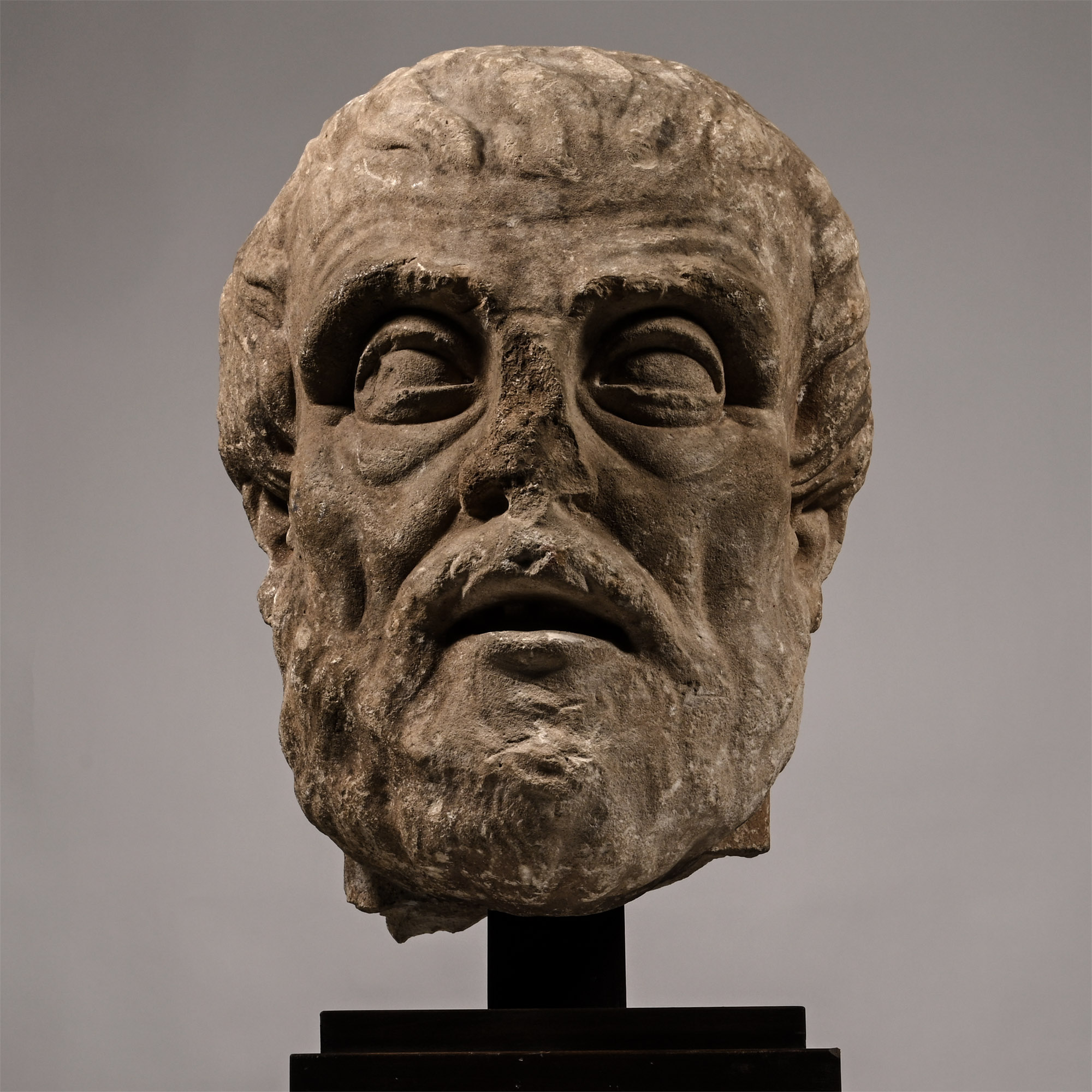 A Roman marble head of a bearded Greek philosopher, probably Diogenes