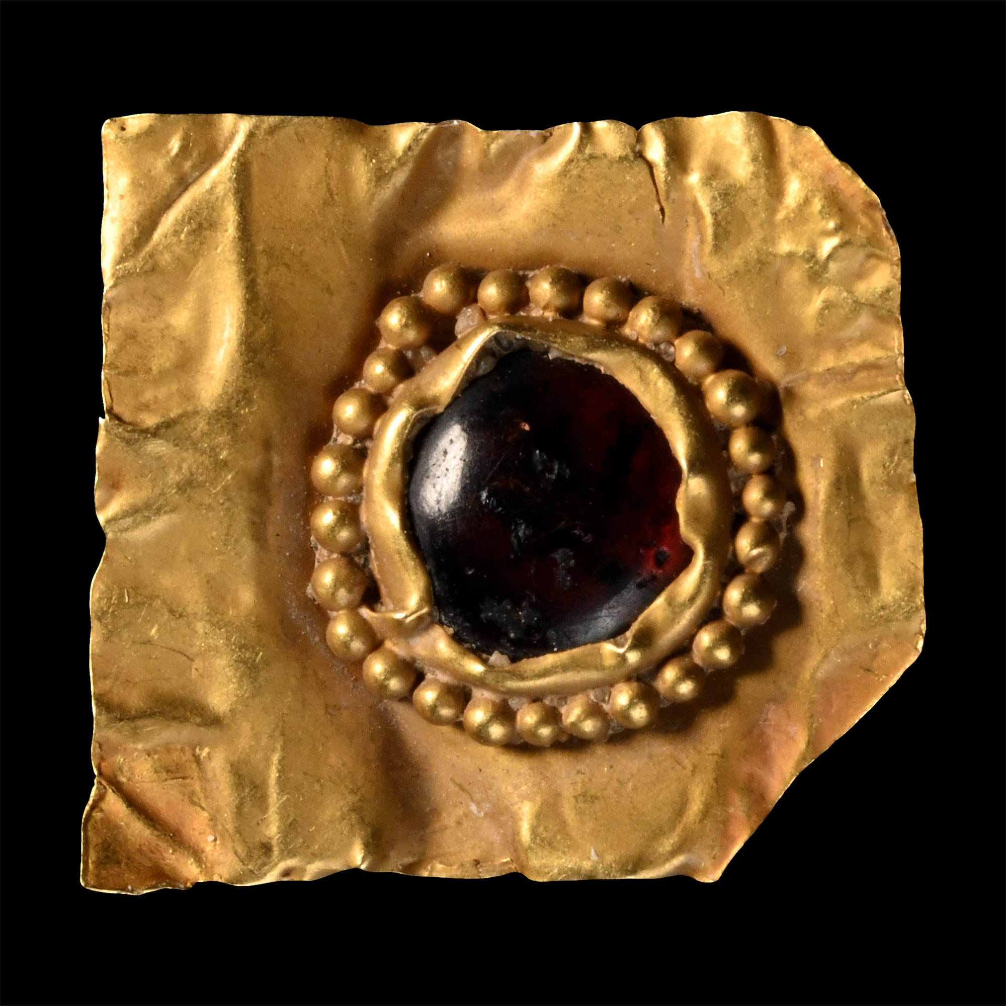 Merovingian Gold Sheet Fragment with Garnet Cabochon