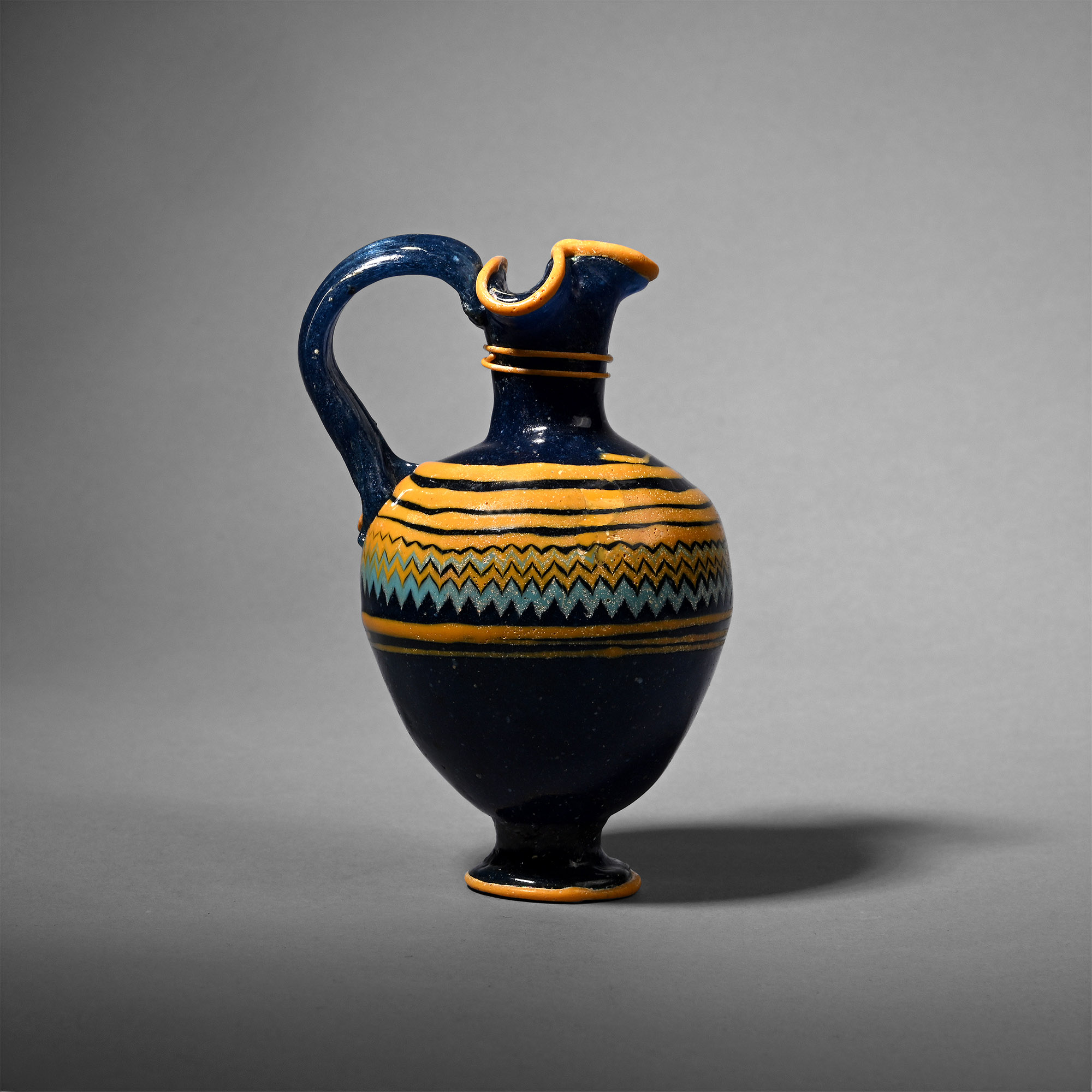 'The Cyrus Collection' Greek Core-Formed Glass Oinochoe
