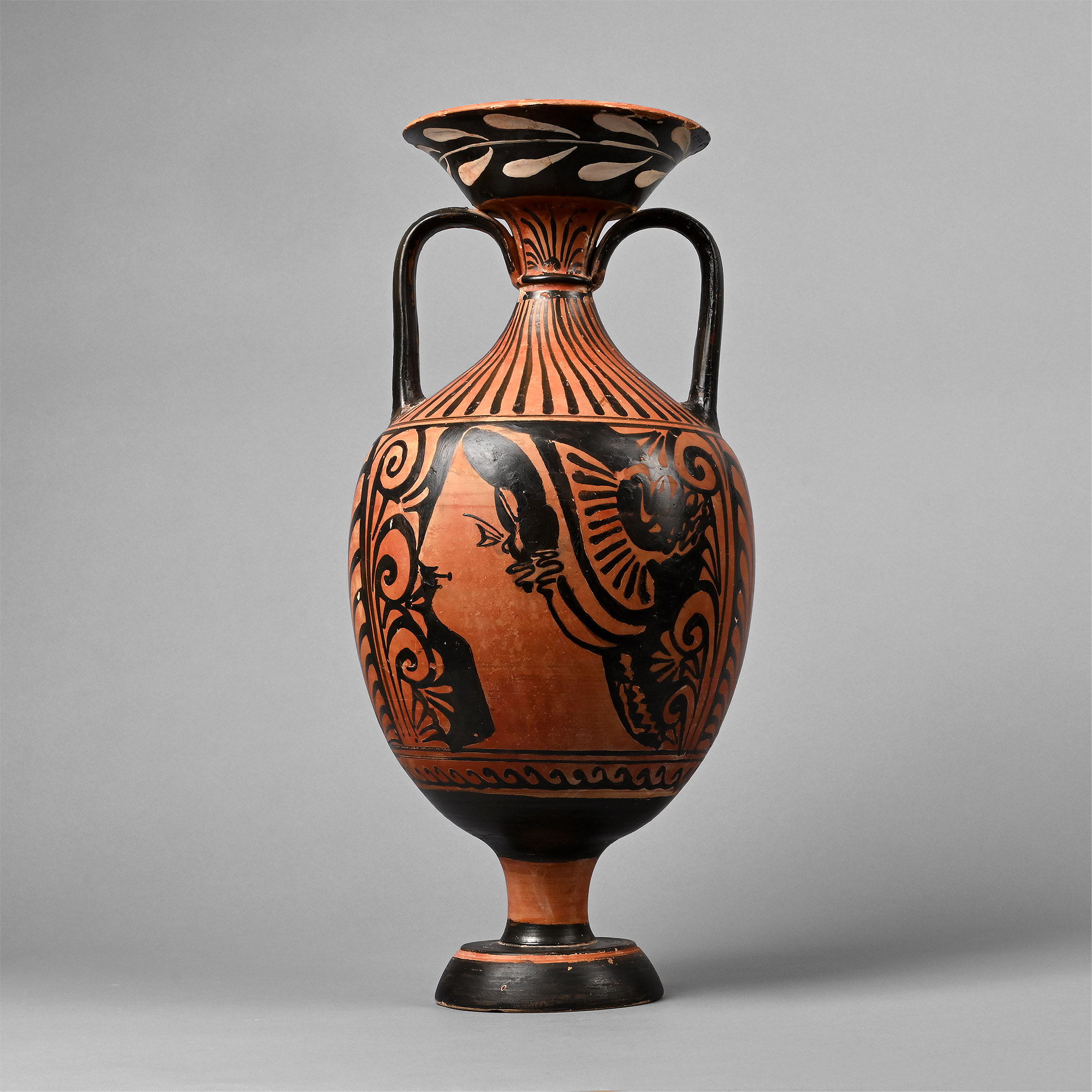 A large Apulian red-figure amphora with a fashionable woman in profile