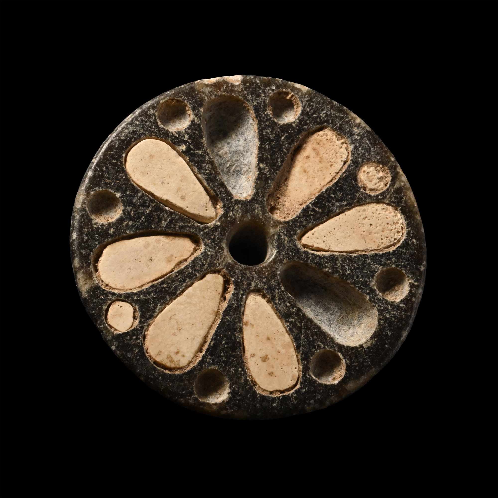 Western Asiatic Stone Flower Roundel with Inlays