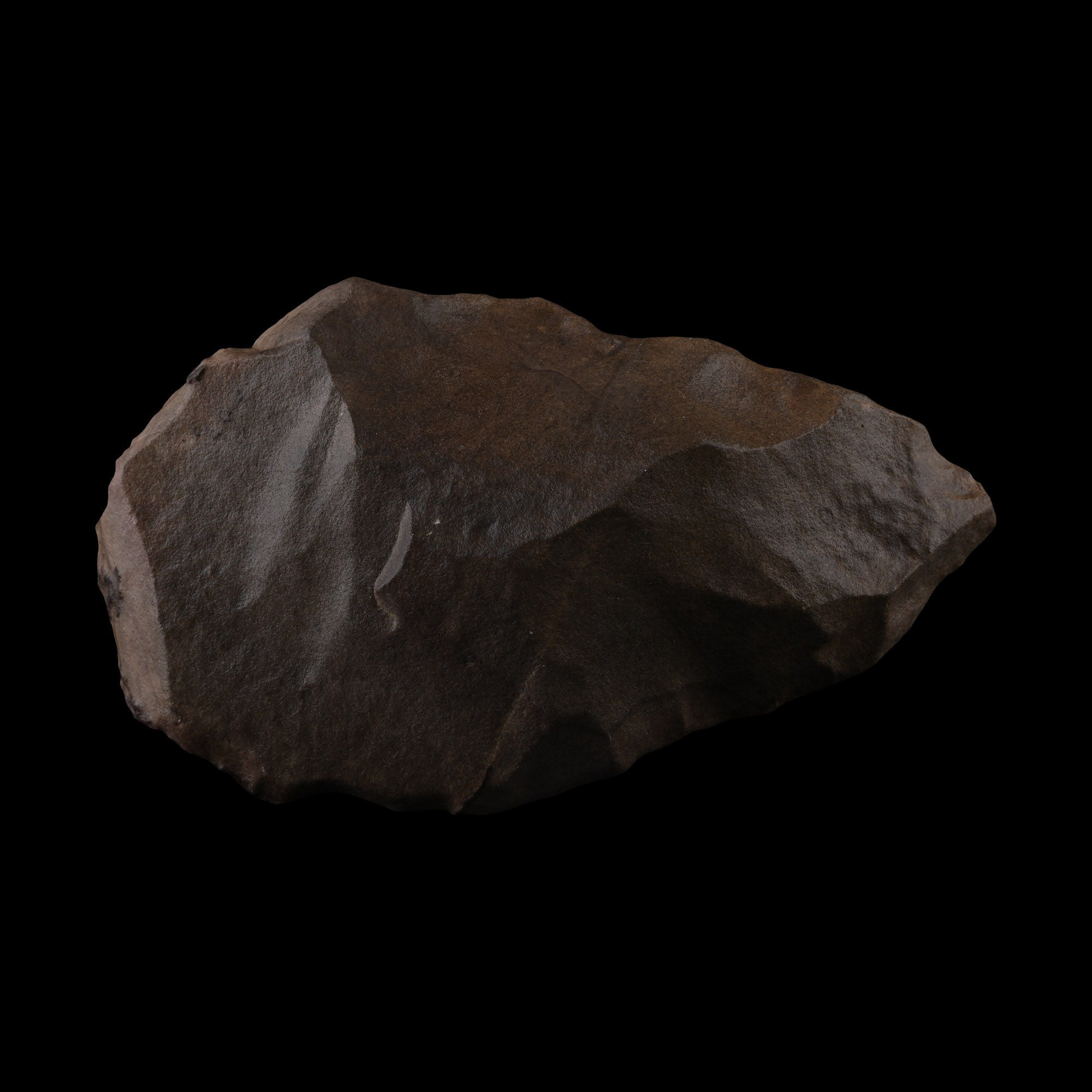 A pointed quartzite Acheulean handaxe with chocolate-brown cortex at the base