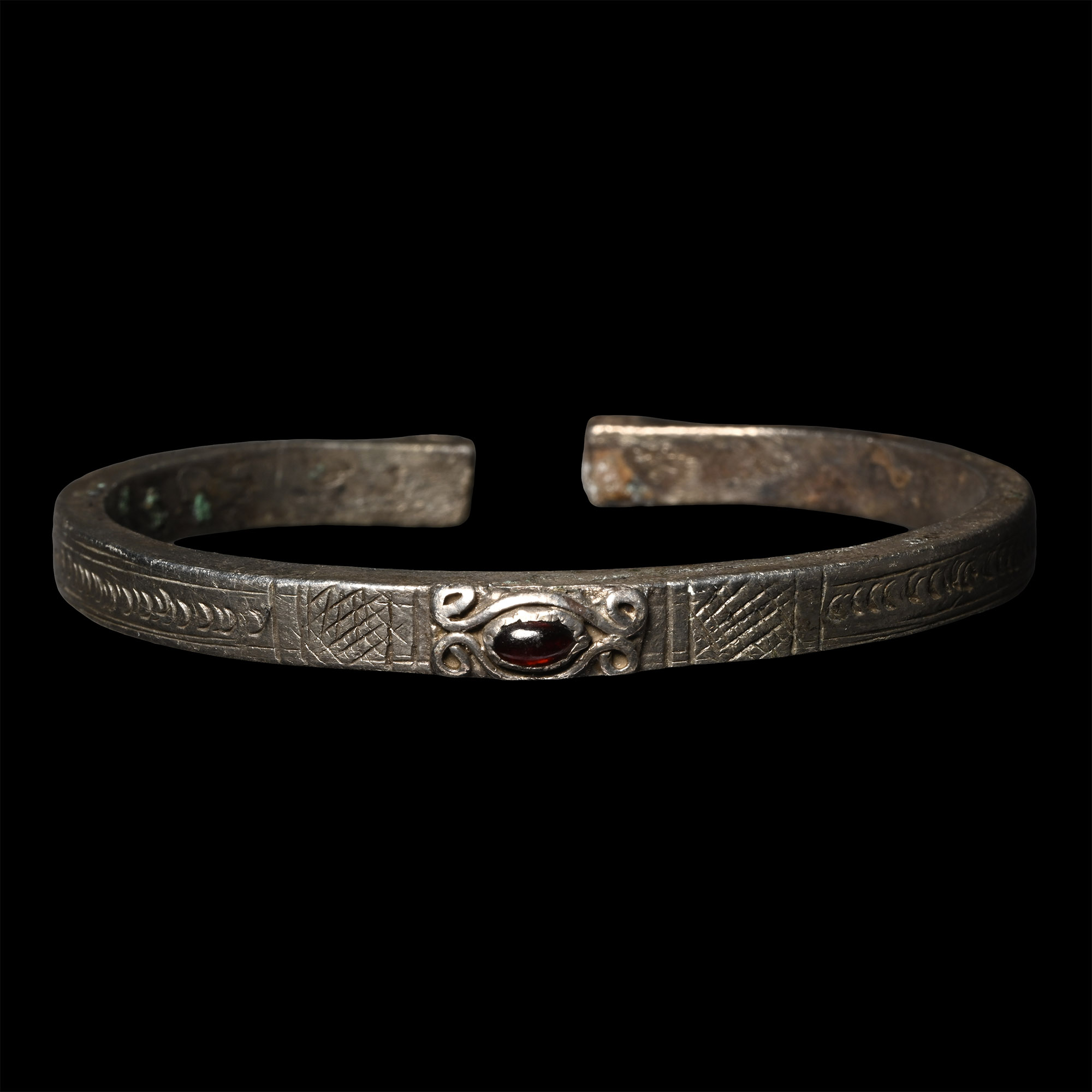 Roman Silver Decorated Bracelet with Cabochon Garnet