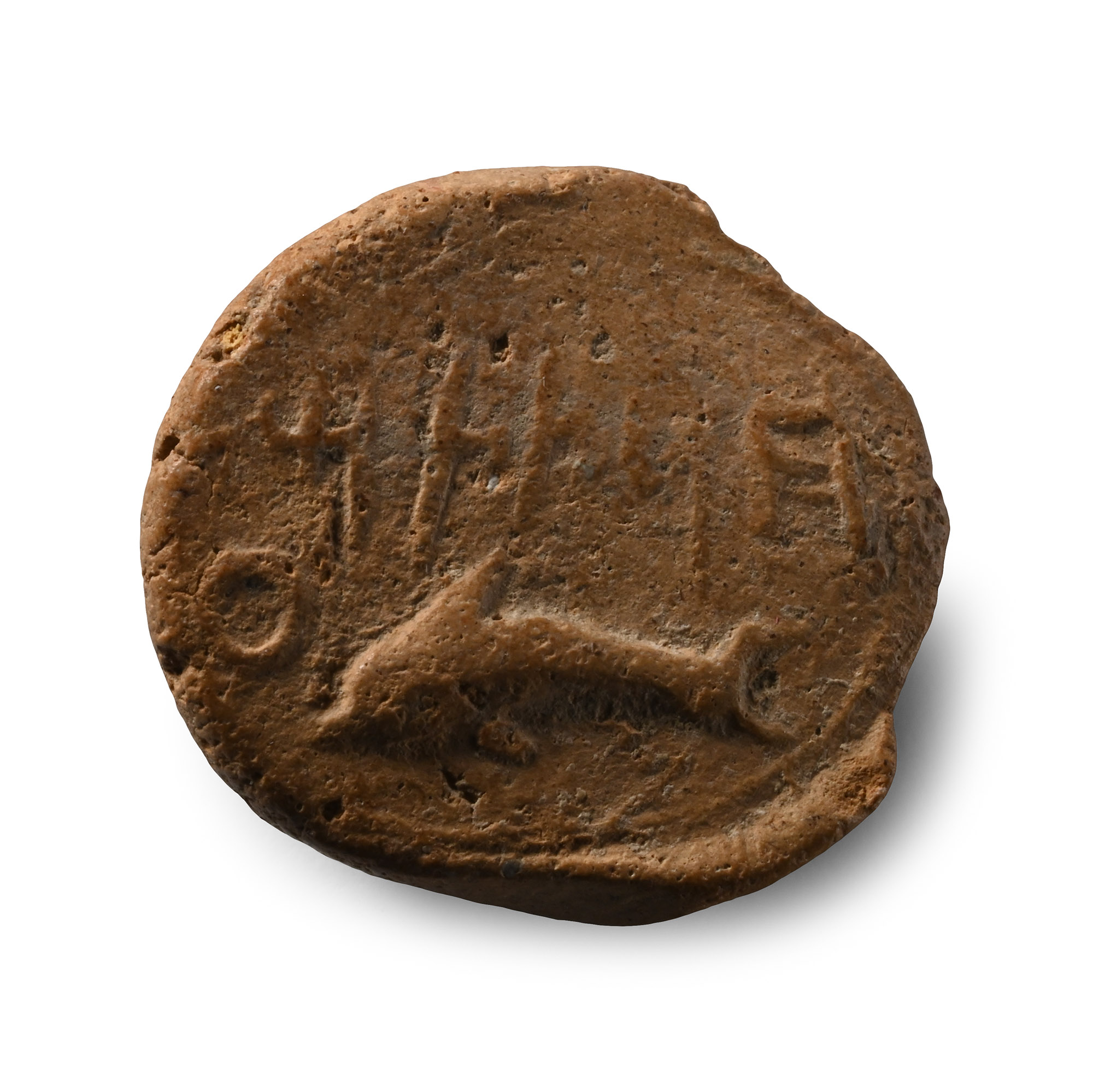Phoenician Terracotta Bulla with a Dolphin
