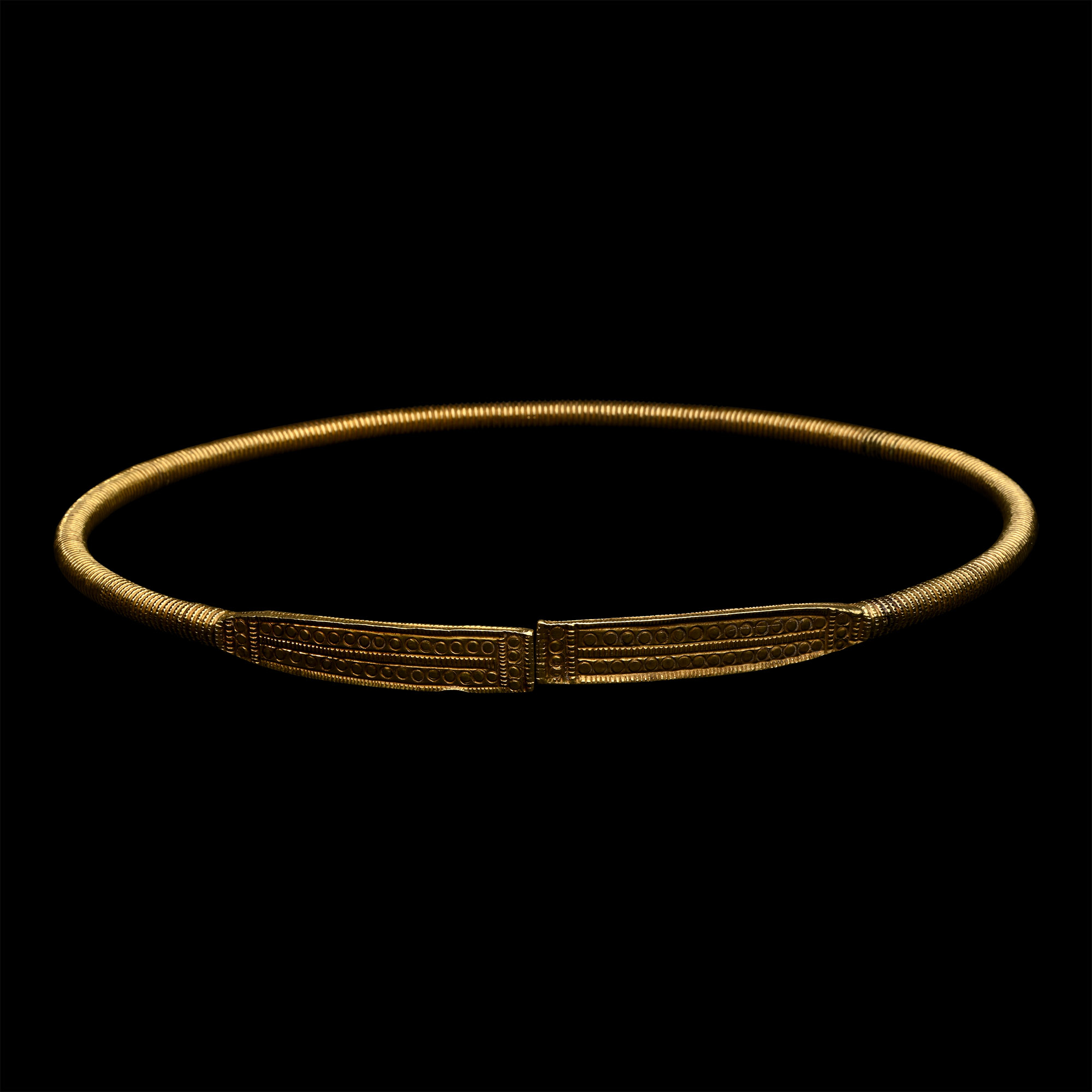 Scythian Gold-Clad Ribbed Torc with Decorated Terminals