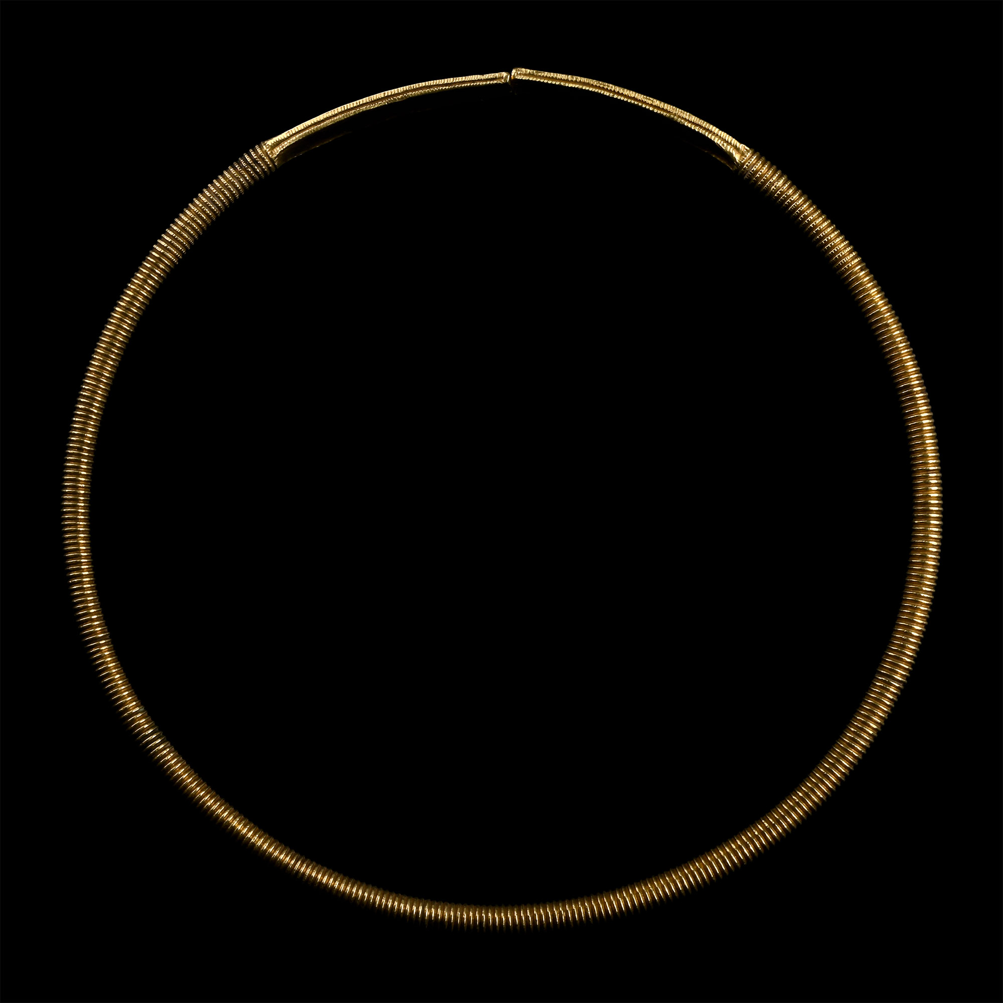 Scythian Gold-Clad Ribbed Torc with Decorated Terminals