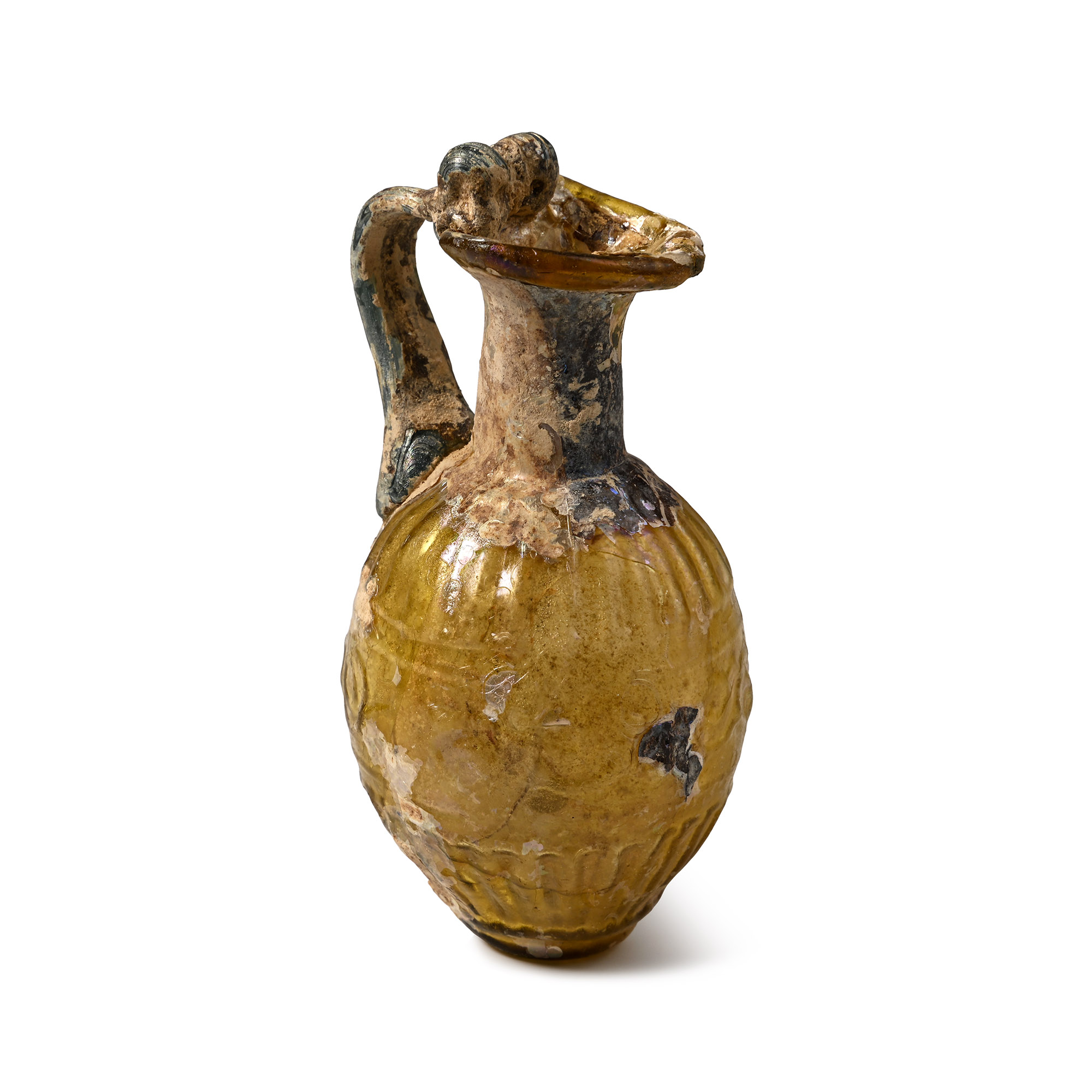 A Roman Sidonian mould-blown amber juglet with vertical corrugations