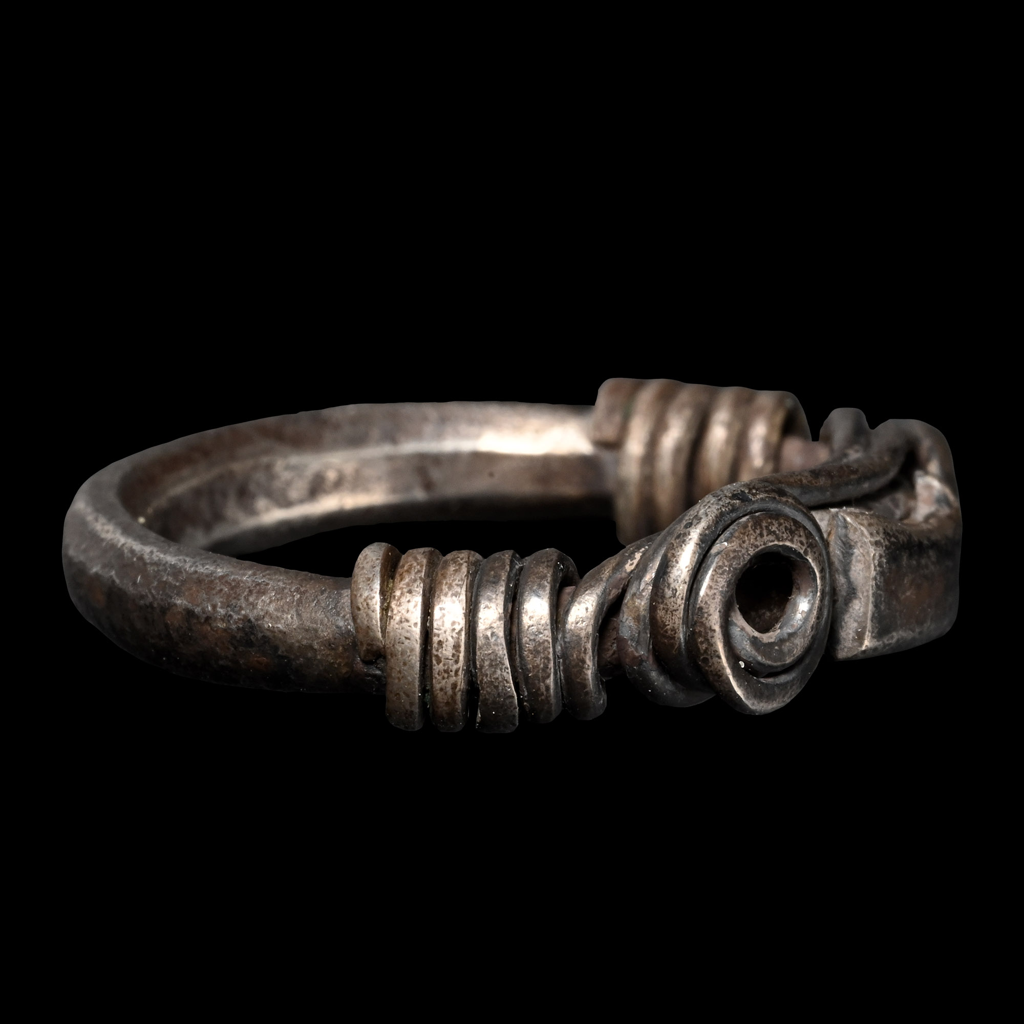 Central Balkans Silver Ring with Spiralled Terminals and Axe Motif Ornament