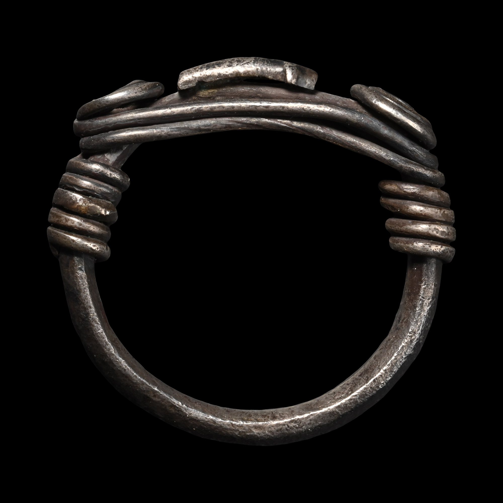 Central Balkans Silver Ring with Spiralled Terminals and Axe Motif Ornament
