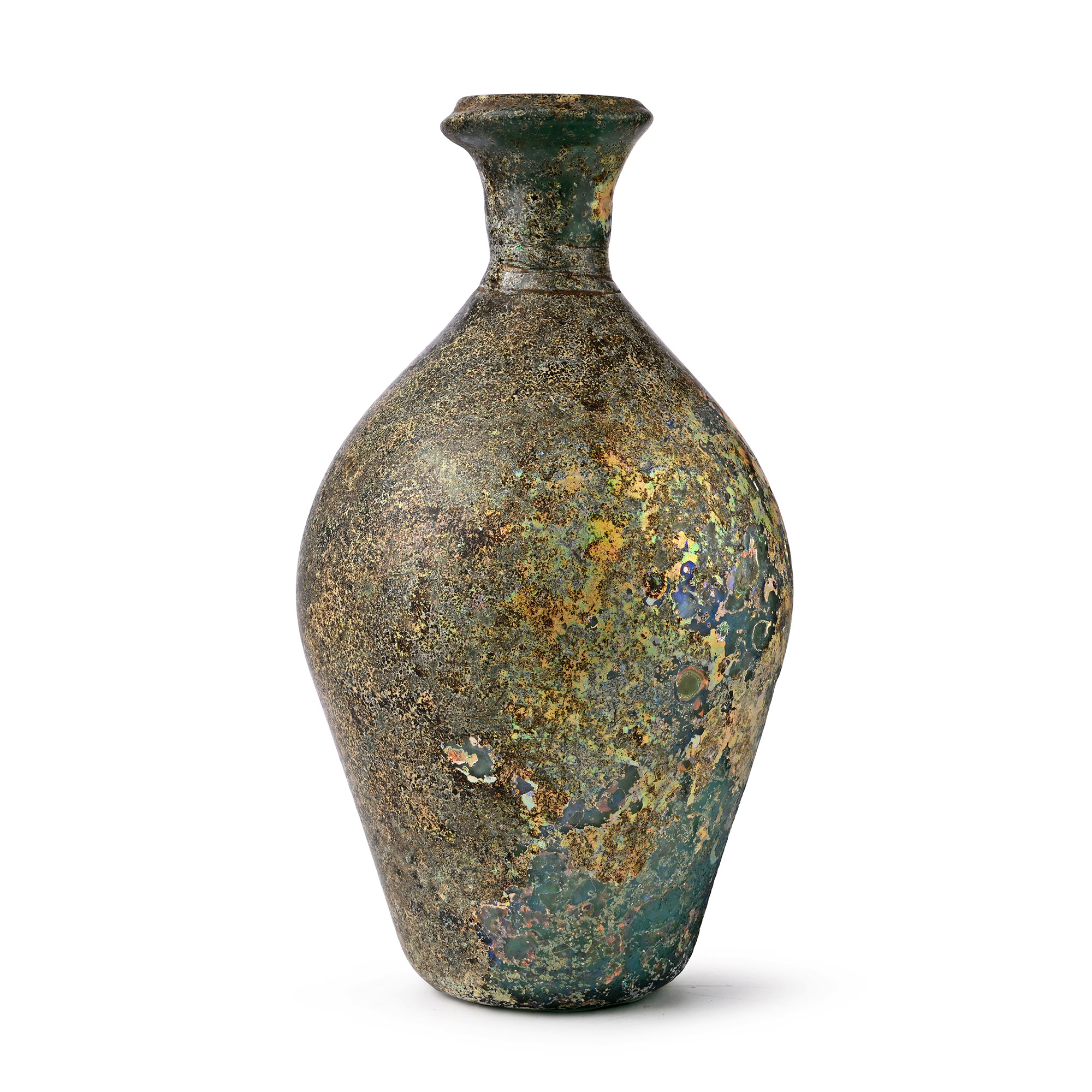 A very large eastern Roman green glass bottle under a golden weathering crust