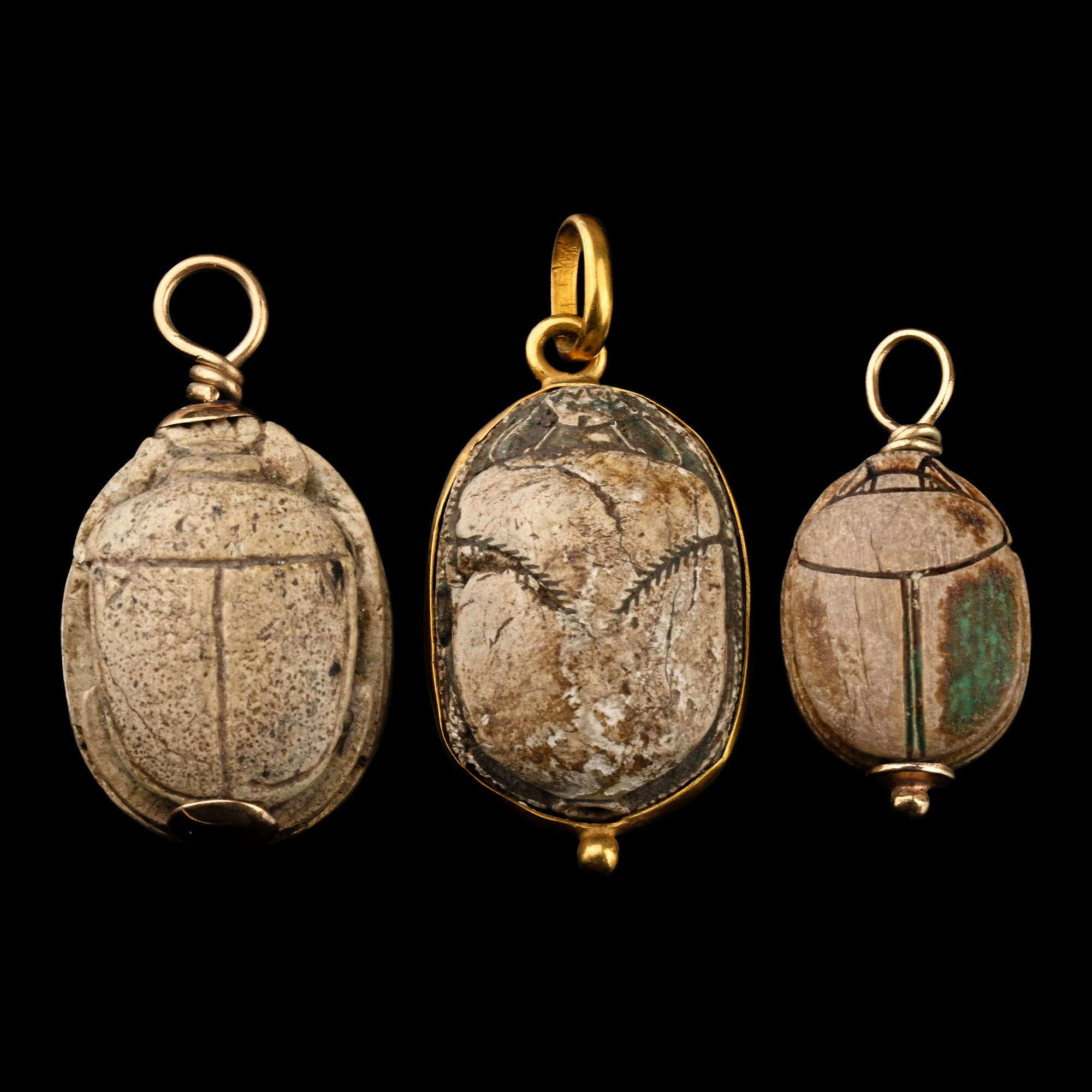 Collection of Egyptian Faience and Steatite Scarabs with Gold Mounts