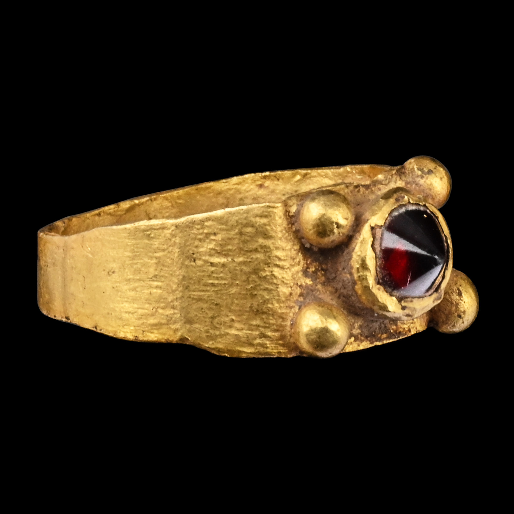 Roman Gold Ring with Conical Ruby-Coloured Gem