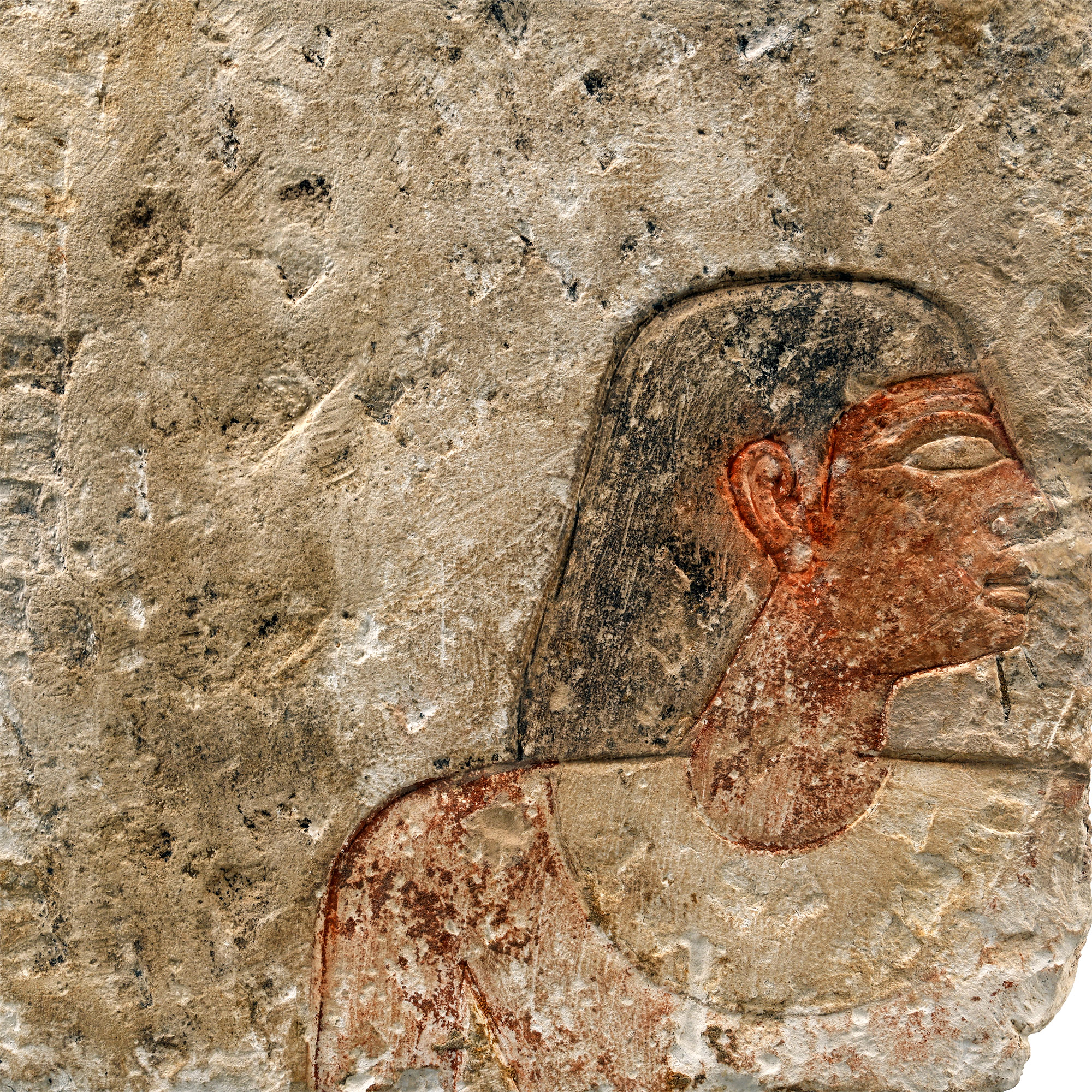 Egyptian Limestone Relief with Painted Head and Hieroglyphics