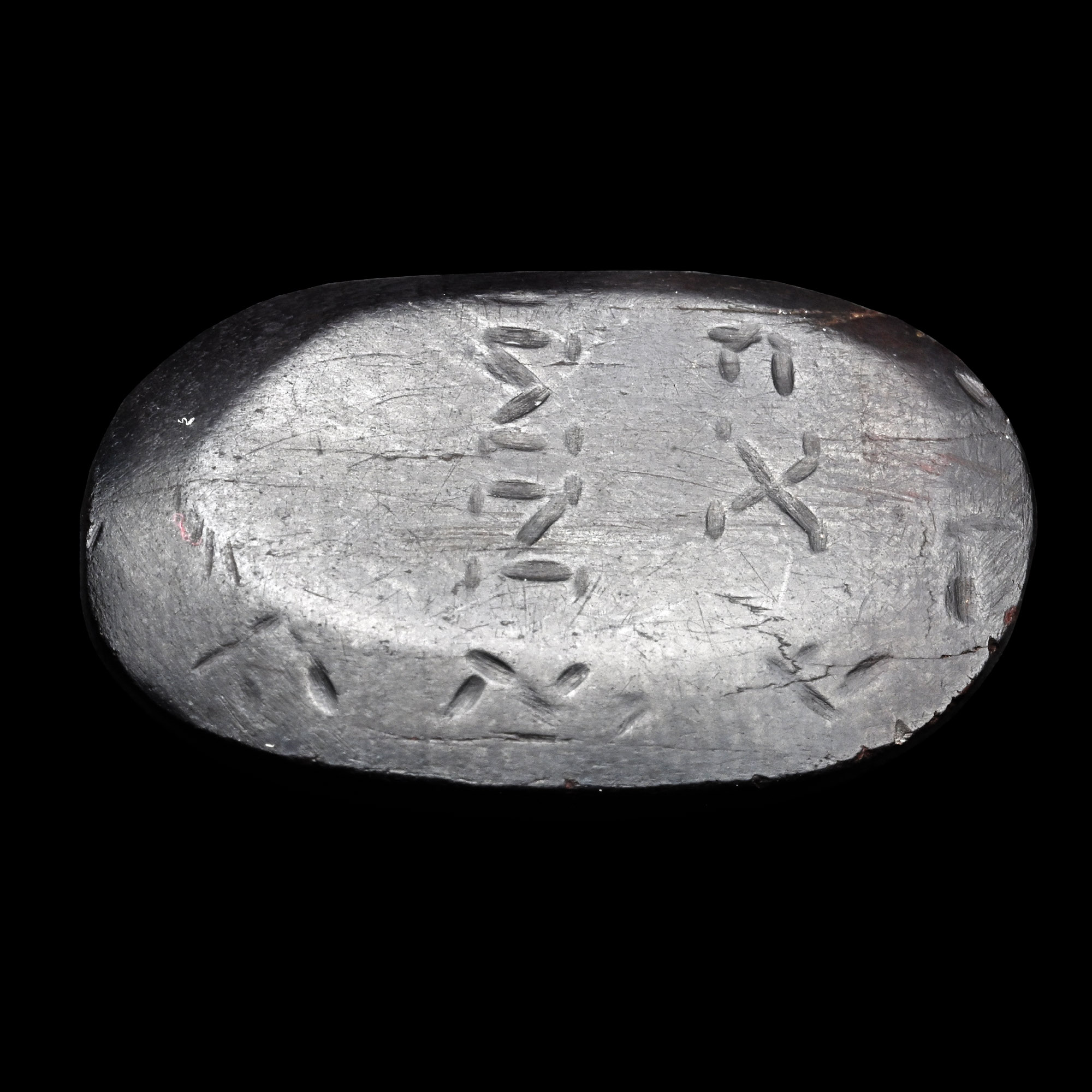 Roman Gnostic Bifacial Hematite Gemstone with Magical Scene and Inscription