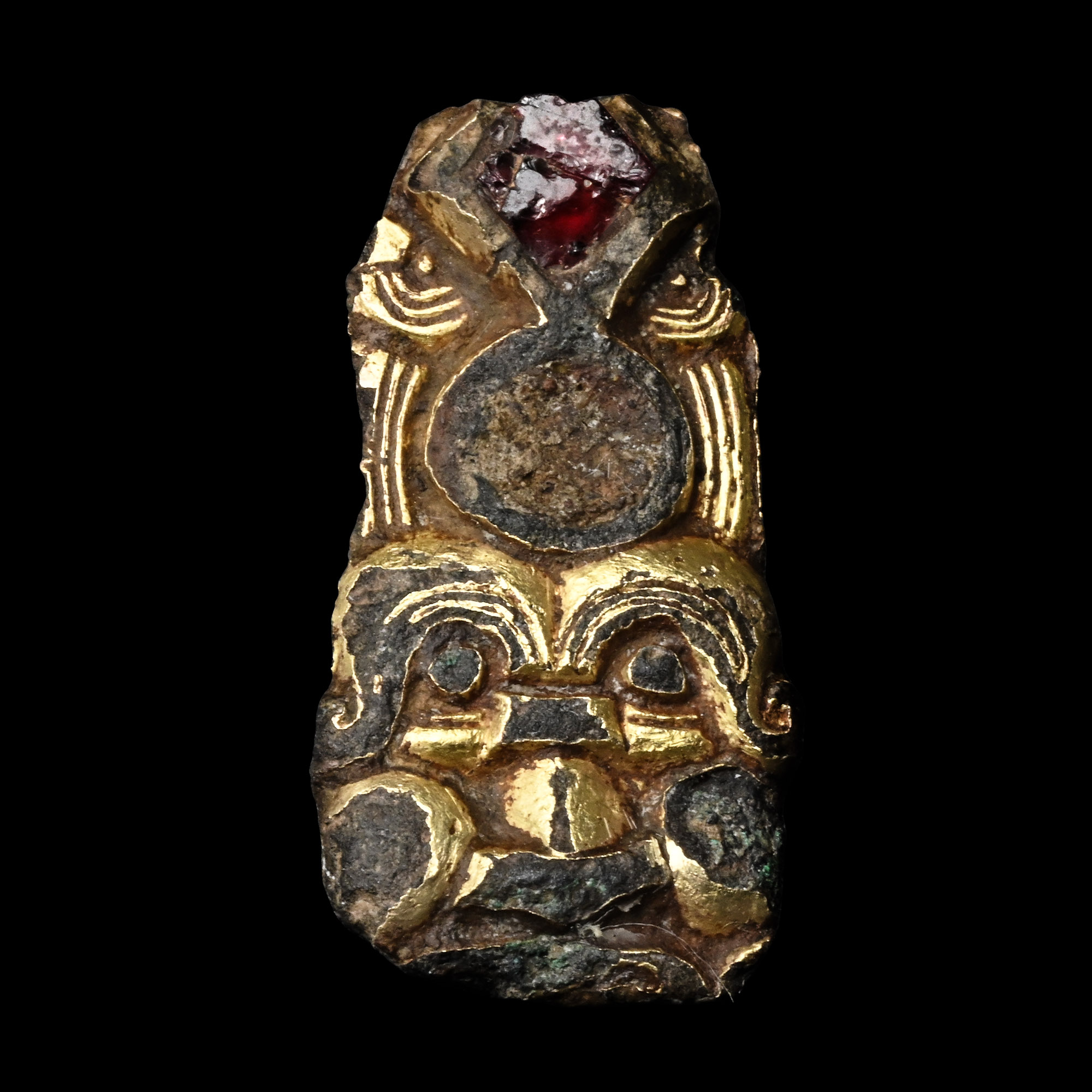 Anglo-Saxon Gilt Bronze Head Mount with Inlaid Garnet