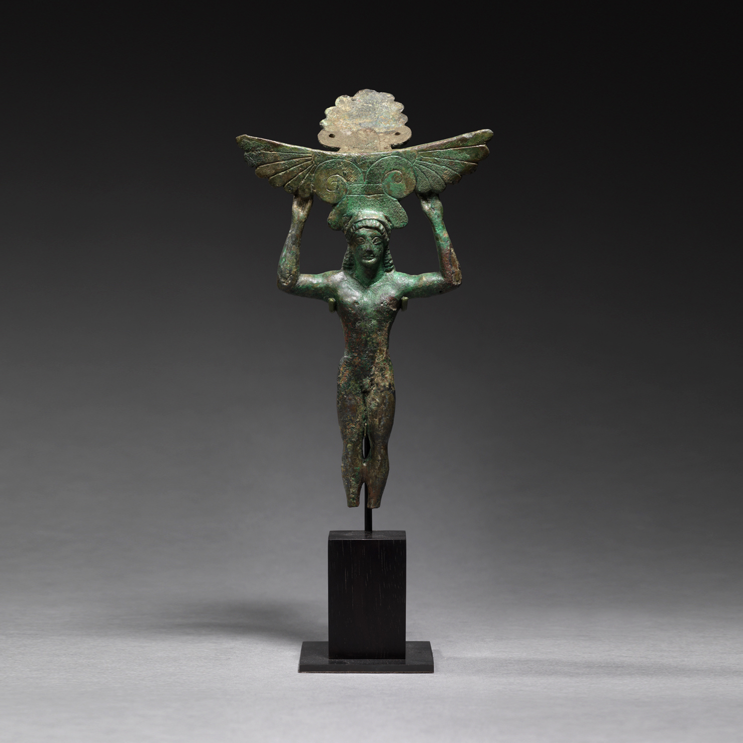 Greek Bronze Patera Handle in the form of a Naked Youth