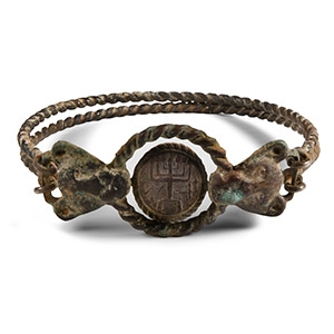 Western Asiatic Silver Bracelet with Lion Head Terminals Holding a Menorah