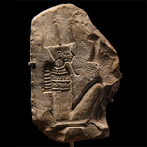 Limestone Fragment with Seated God