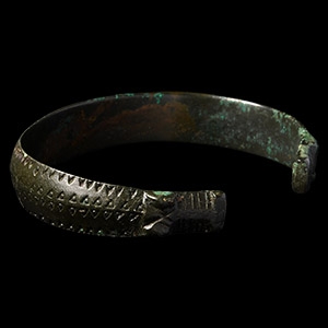 Viking Age Bronze Stamped Bracelet with Beast Head Terminals