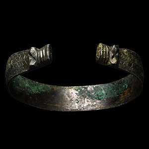 Viking Age Stamped Bronze Bracelet with Beast Head Terminals