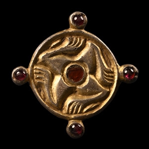 Merovingian Silver-Gilt Leg Whorl Brooch with Garnets