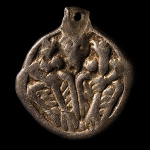 Viking Silver-Gilt Pendant with Odin Gripping Two Ravens