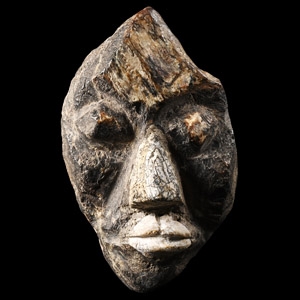 Natural History - Mastodon Bone Face Carving