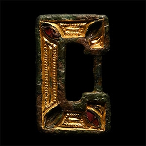 Anglo-Saxon Gilt Chip-Carved Buckle Frame with Garnets