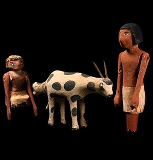 Painted Wooden Model of a Cow Giving Birth, Together with Two Figures