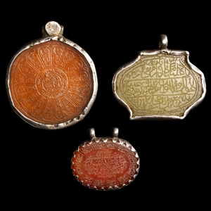 Stone Pendant Group with Calligraphic Inlays