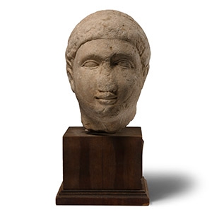Cypriot Votive Limestone Head of a Young Man