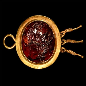 Gold Pendant with Garnet Gemstone Depicting Victory