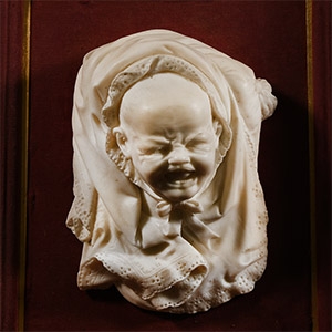 Framed Marble Bust of a Crying Baby